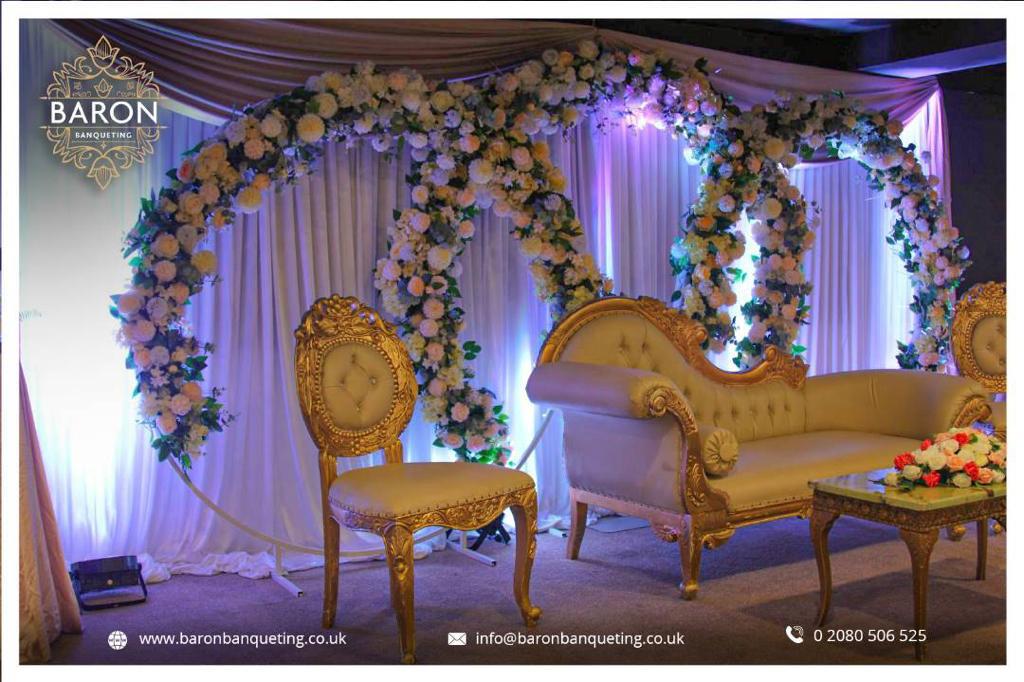 Elegant Baron Lounge with floral backdrop, ideal for weddings and upscale events.