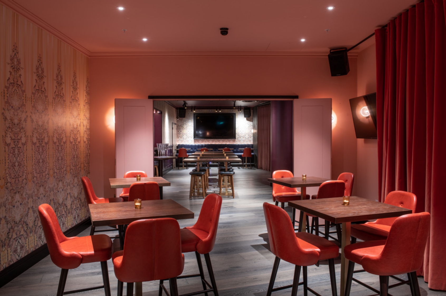 Ruby Rose Private Room at Puttshack Bank, modern event space for meetings and gatherings.