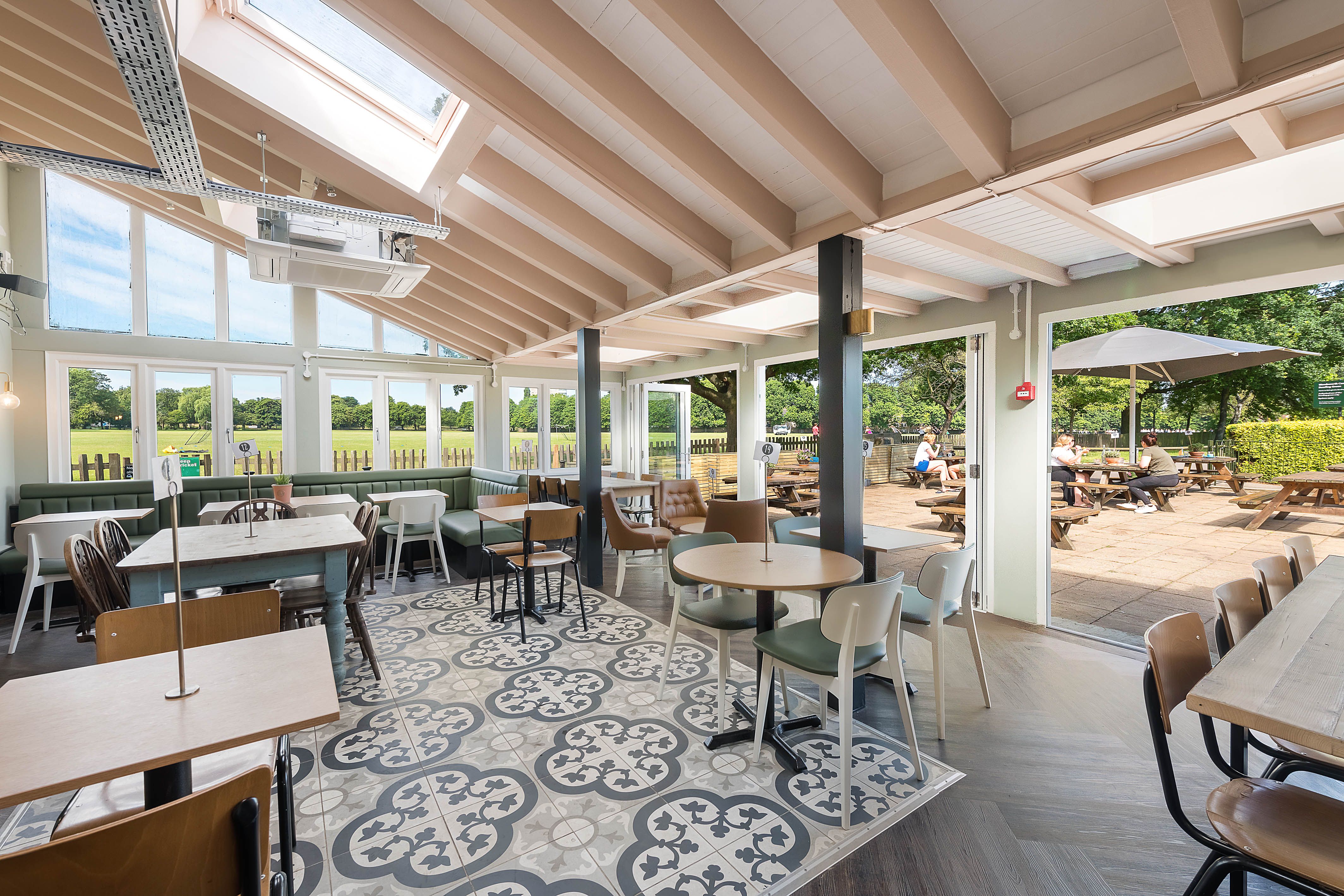 Bright event space at The Skylark Cafe with large windows, perfect for networking and workshops.