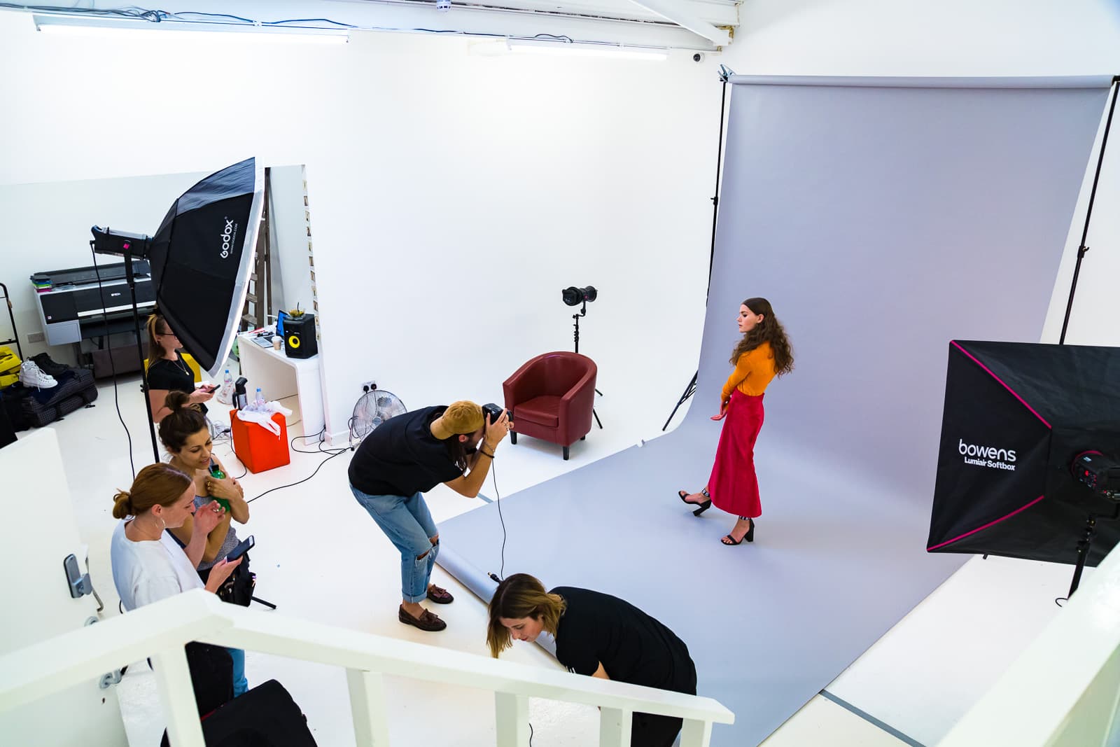 Dynamic photoshoot setup at Blankbox Studio with minimalist backdrop for promotional content.