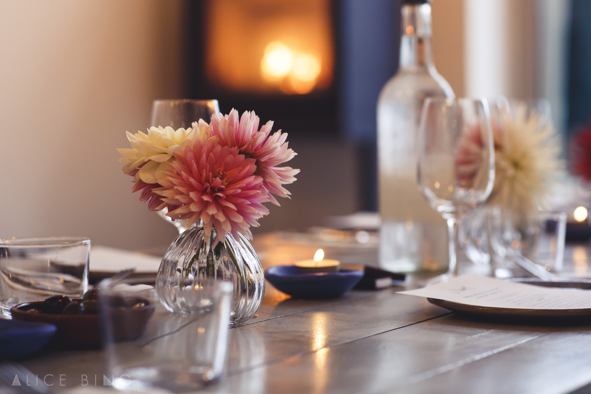 Elegant dining table with floral centerpiece for corporate dinner or intimate gathering.
