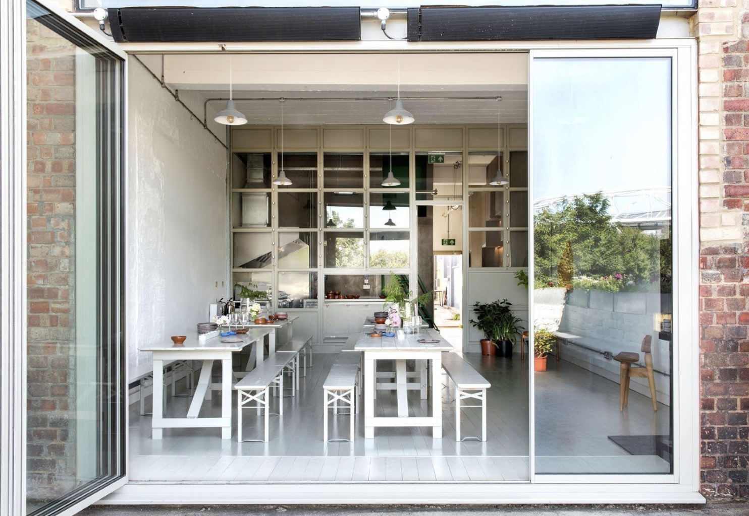 Modern event space with large windows, ideal for workshops and gatherings.