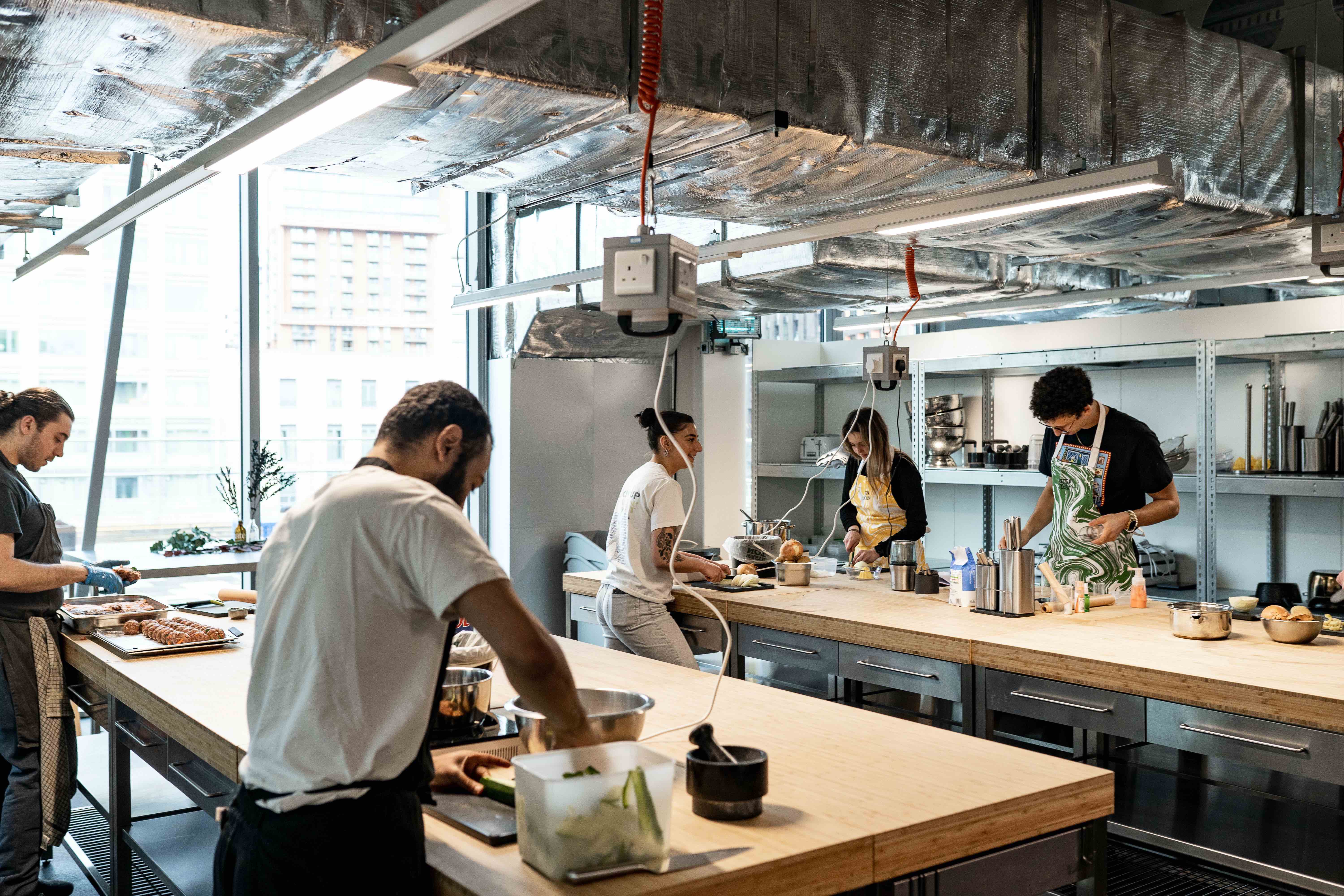 Modern kitchen in Mission Kitchen, ideal for culinary events and team-building workshops.
