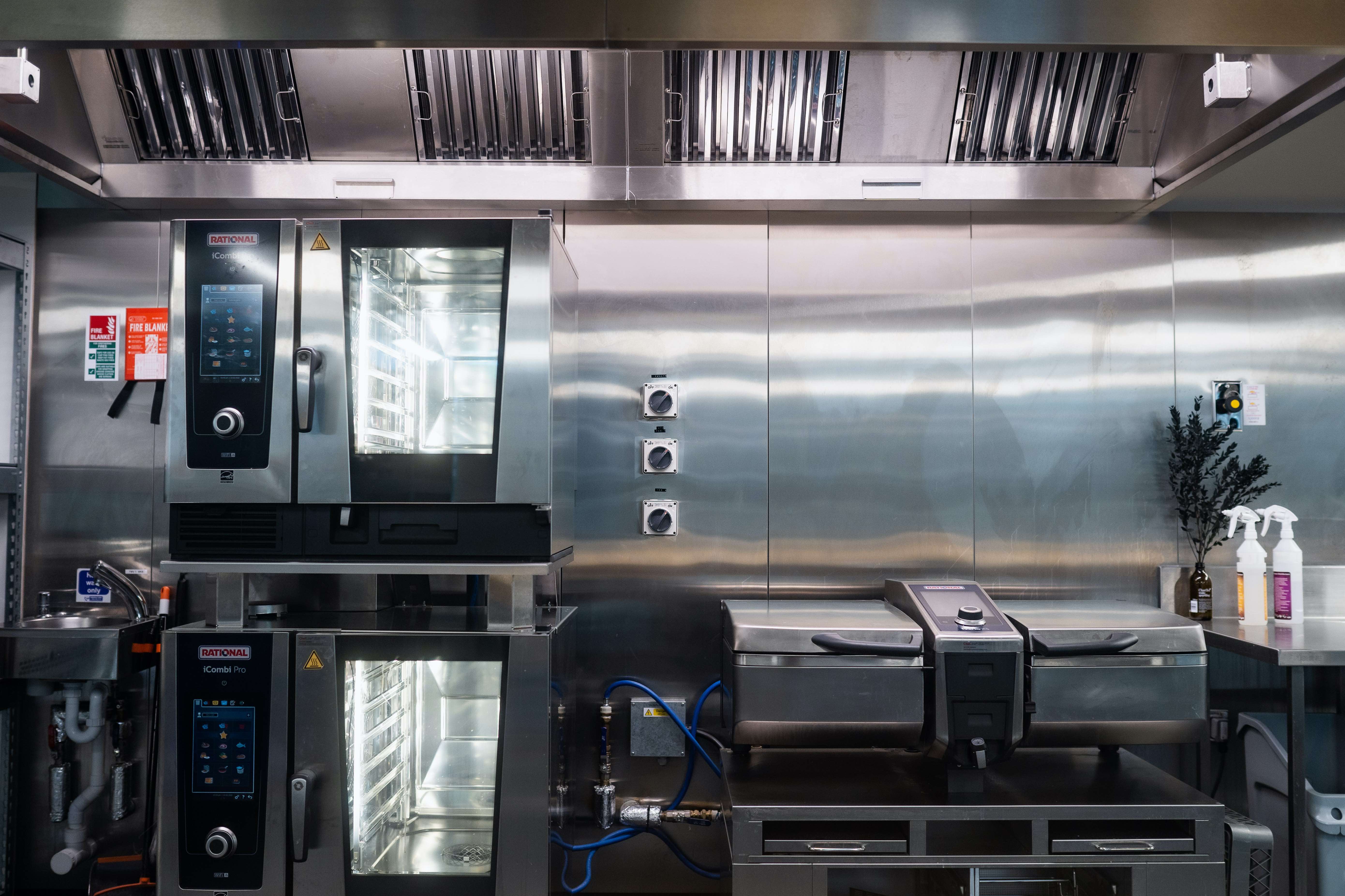 Modern commercial kitchen with stainless steel design for efficient event catering.
