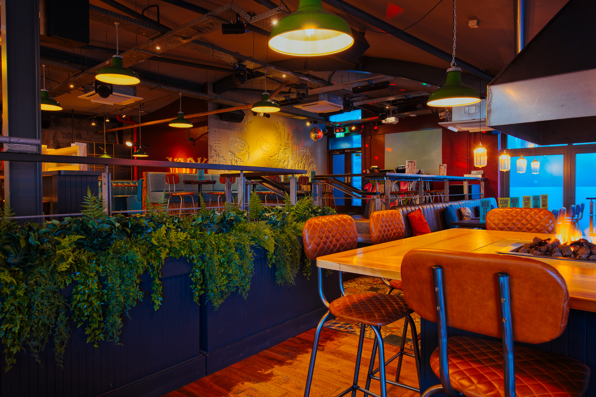 Stylish event space at The Terrace, Revolution Aberdeen with warm lighting and greenery.