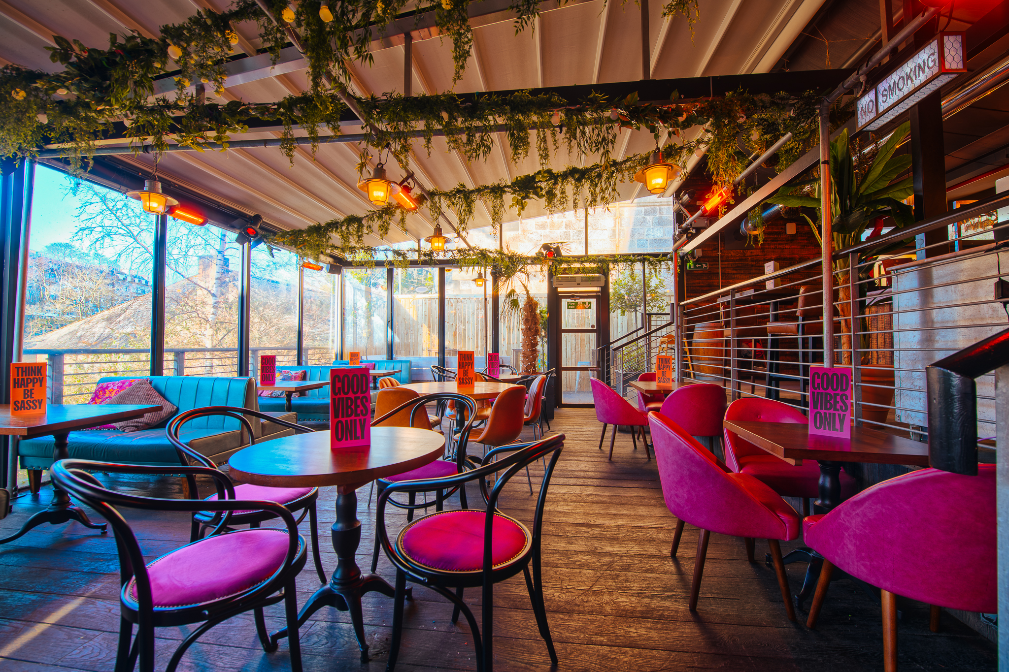 Vibrant event space at The Terrace, Revolution Aberdeen with colorful seating and greenery.