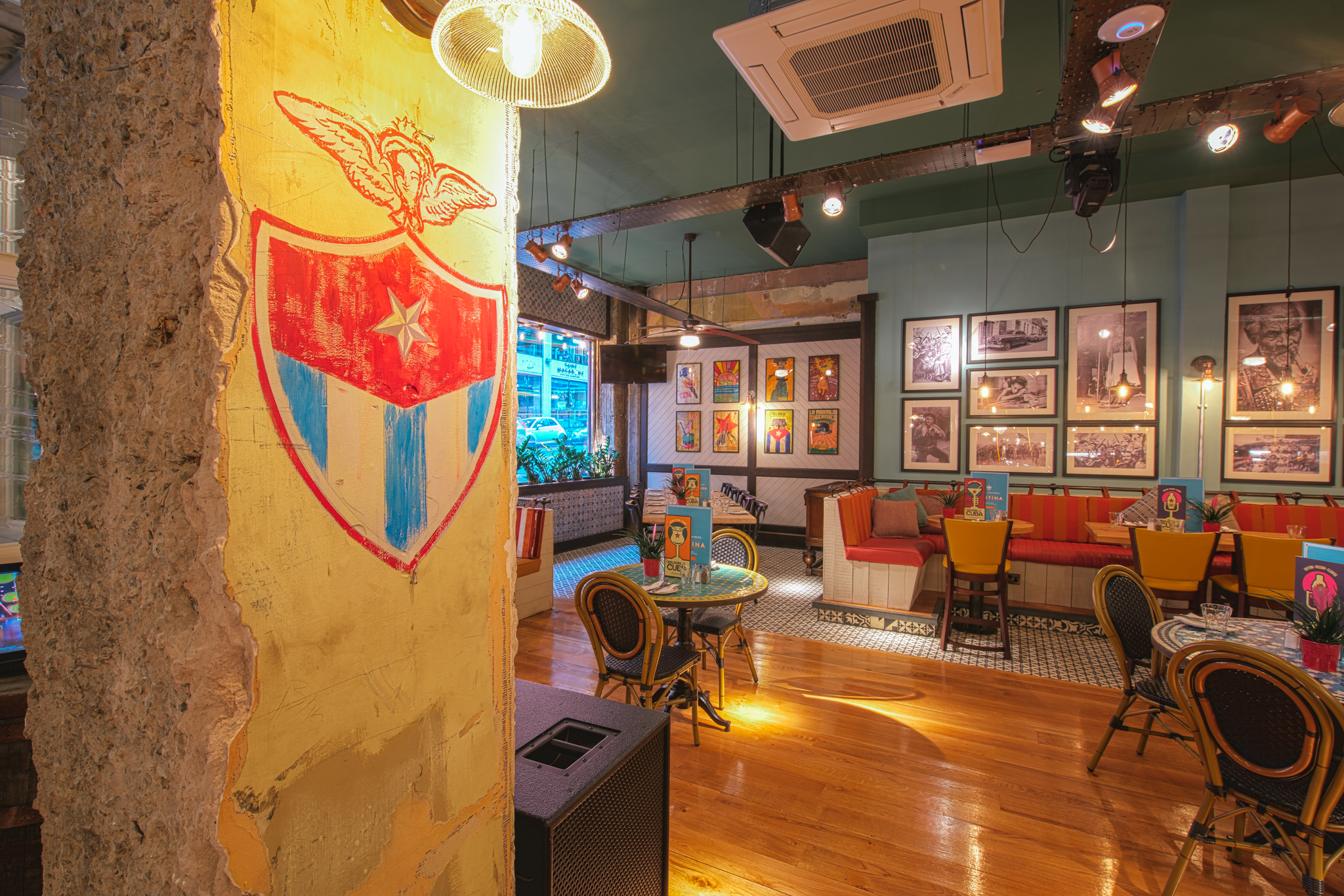 Vibrant event space in Revolucion de Cuba Glasgow with colorful wall art for gatherings.