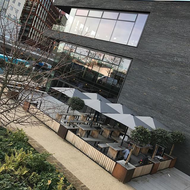 Canalside Bar at The Lighterman - modern outdoor event space with stylish seating and greenery.