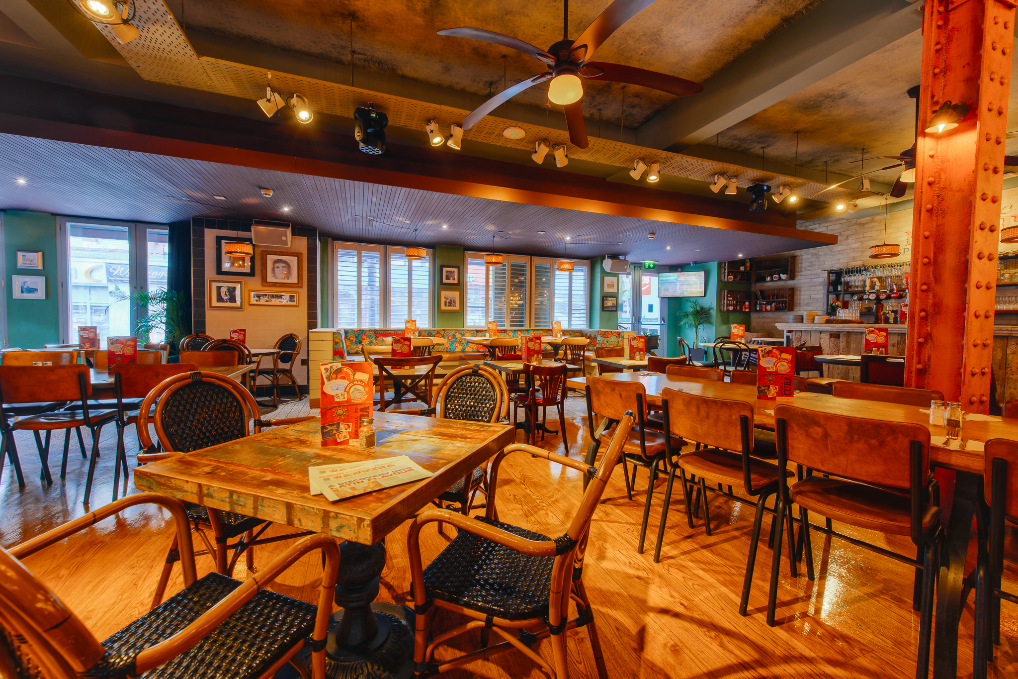 Whole Venue Hire at Revolucion de Cuba Leeds, featuring wooden tables for events.