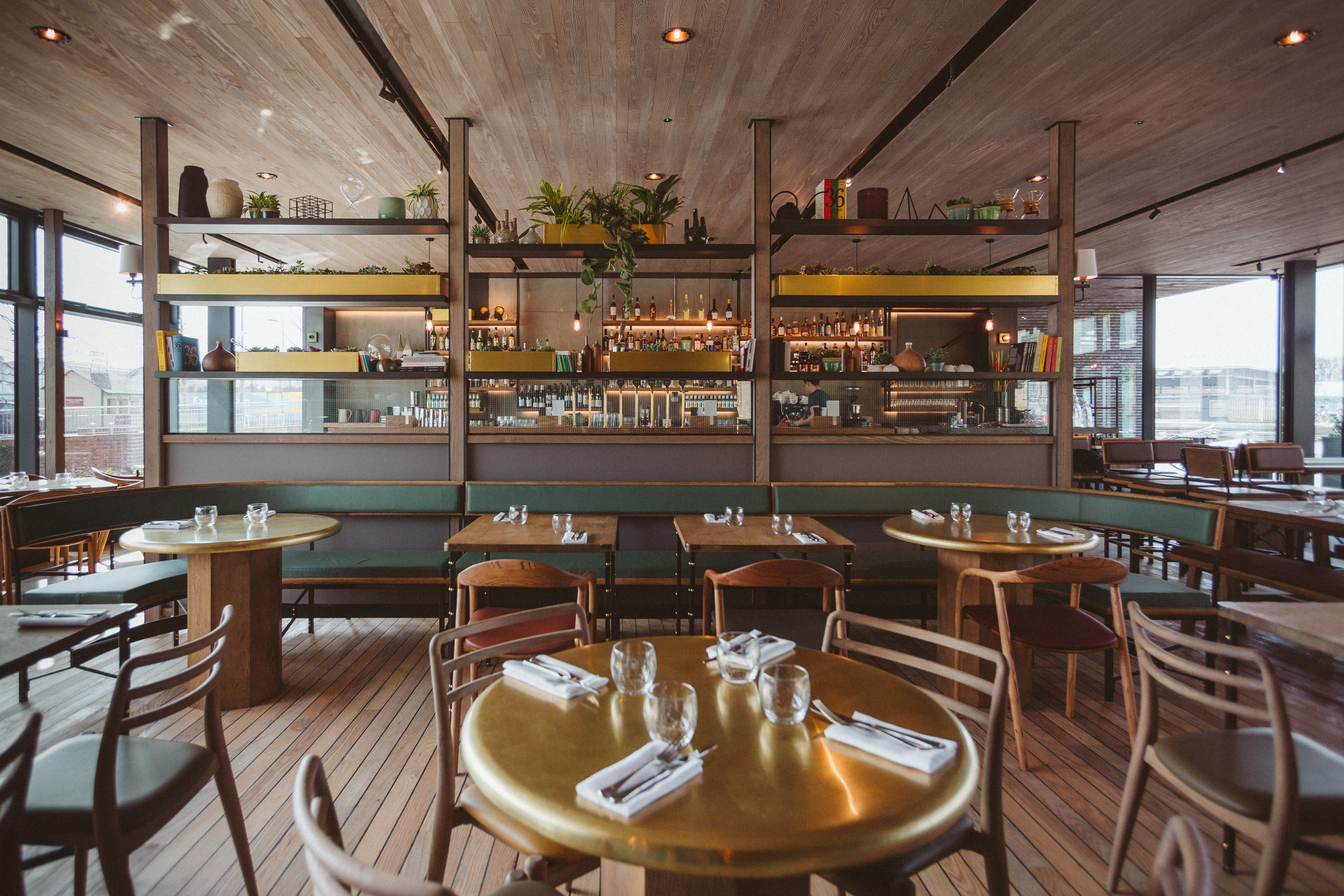 Modern dining space with wooden floors for intimate gatherings and events at The Lighterman.