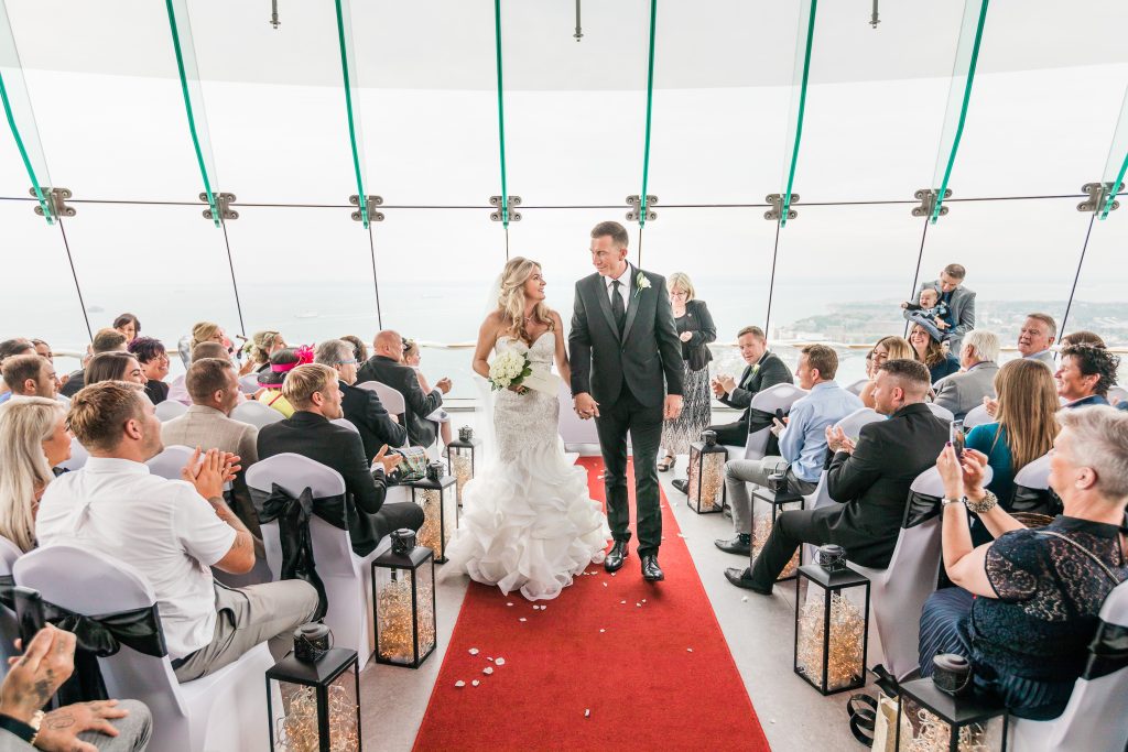 Wedding ceremony at Spinnaker Tower with panoramic views and elegant decor.