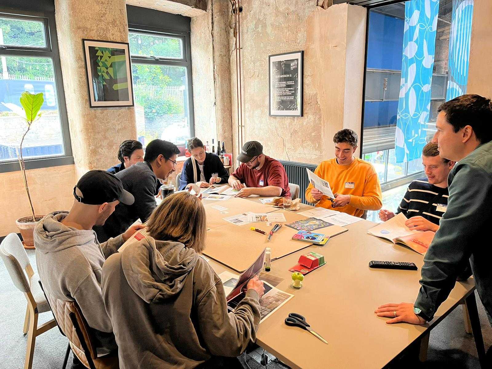 Collaborative workshop at North Brewing Co, featuring teamwork in a bright space.