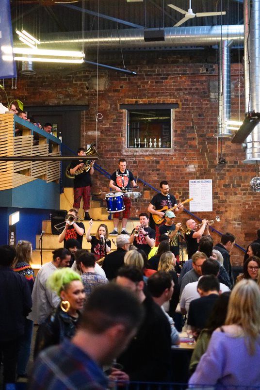 Live band at North Brewing Co, vibrant event atmosphere for networking and socializing.