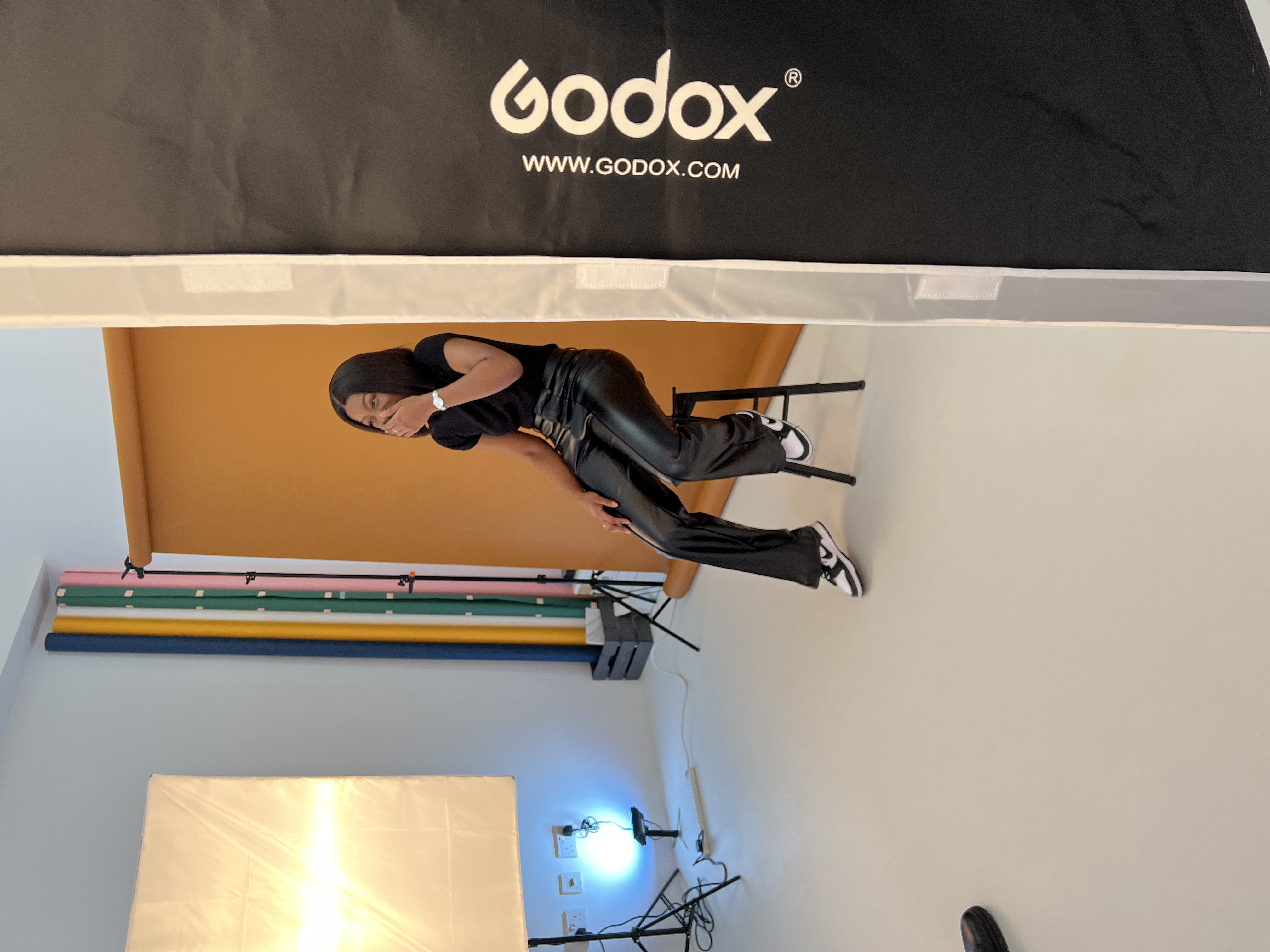 Professional photoshoot studio with model, ideal for branding events and promotions.