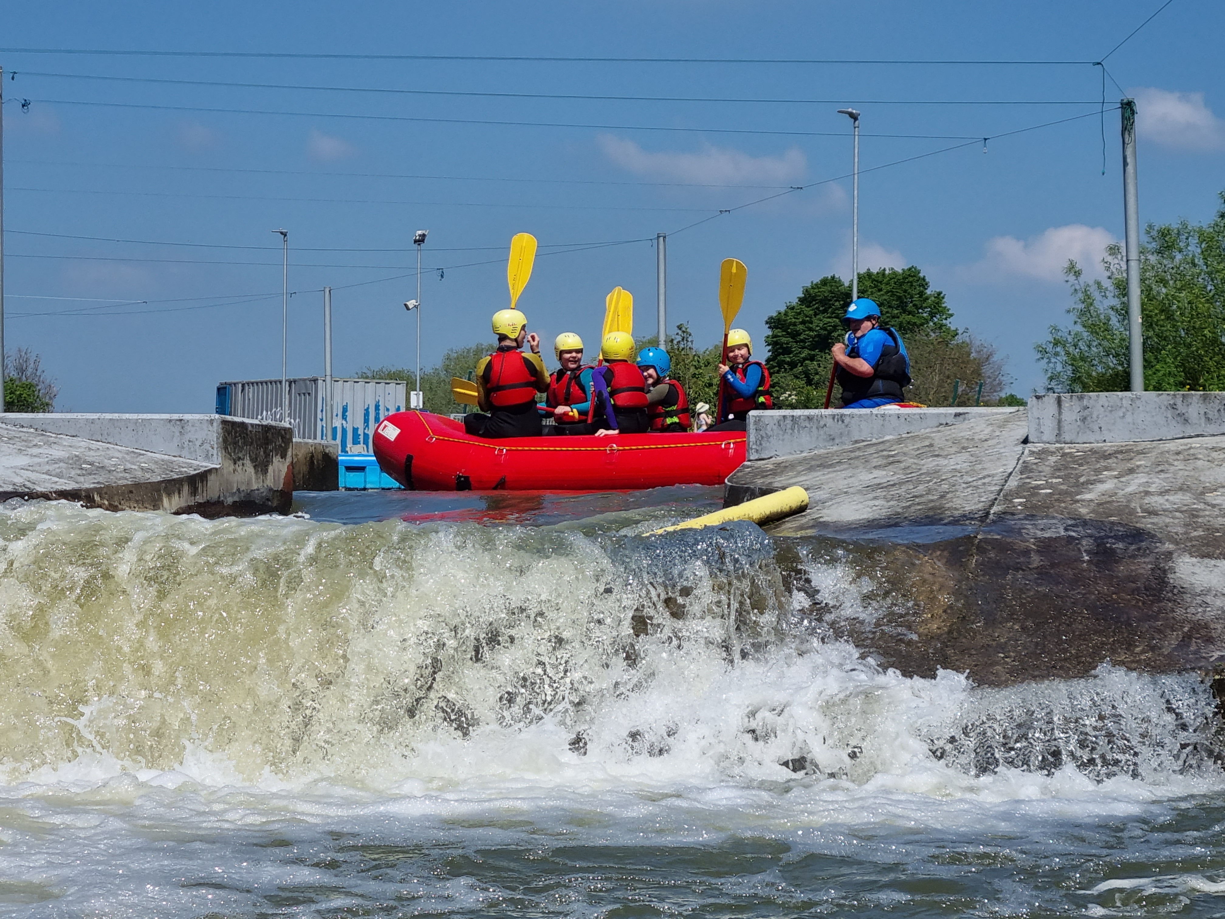 Group preparing for white-water rafting in Waterside Suite, Northampton; team-building adventure.