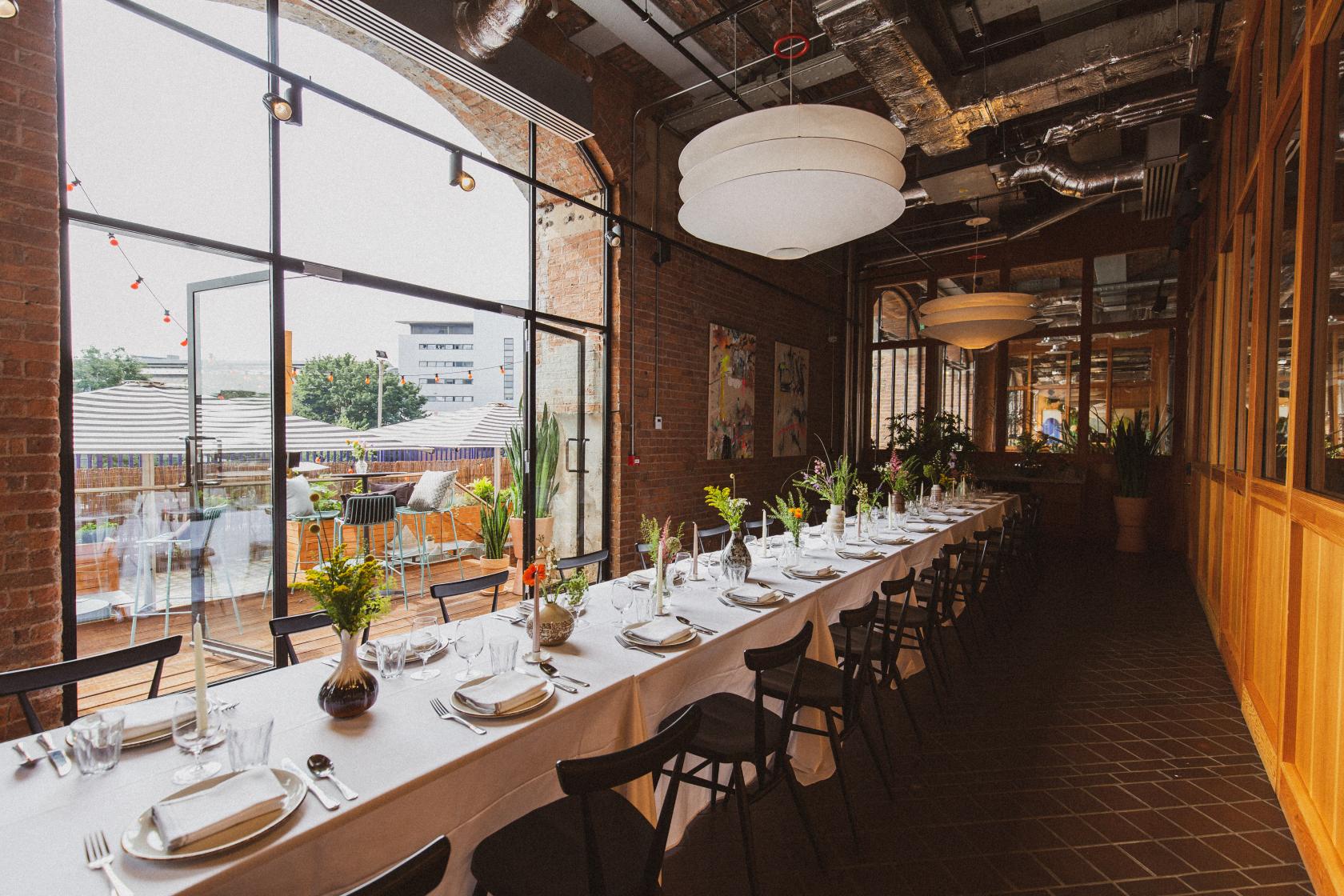 Elegant dining space with floral centerpieces for corporate events and gatherings.
