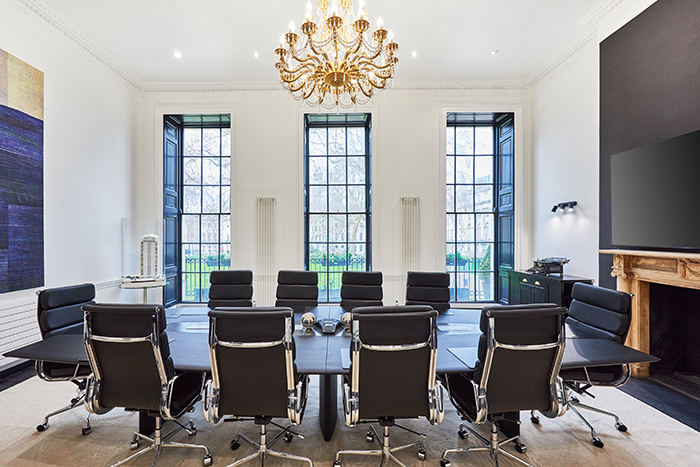 Modern conference room with chandelier at George House Business Centre for meetings.