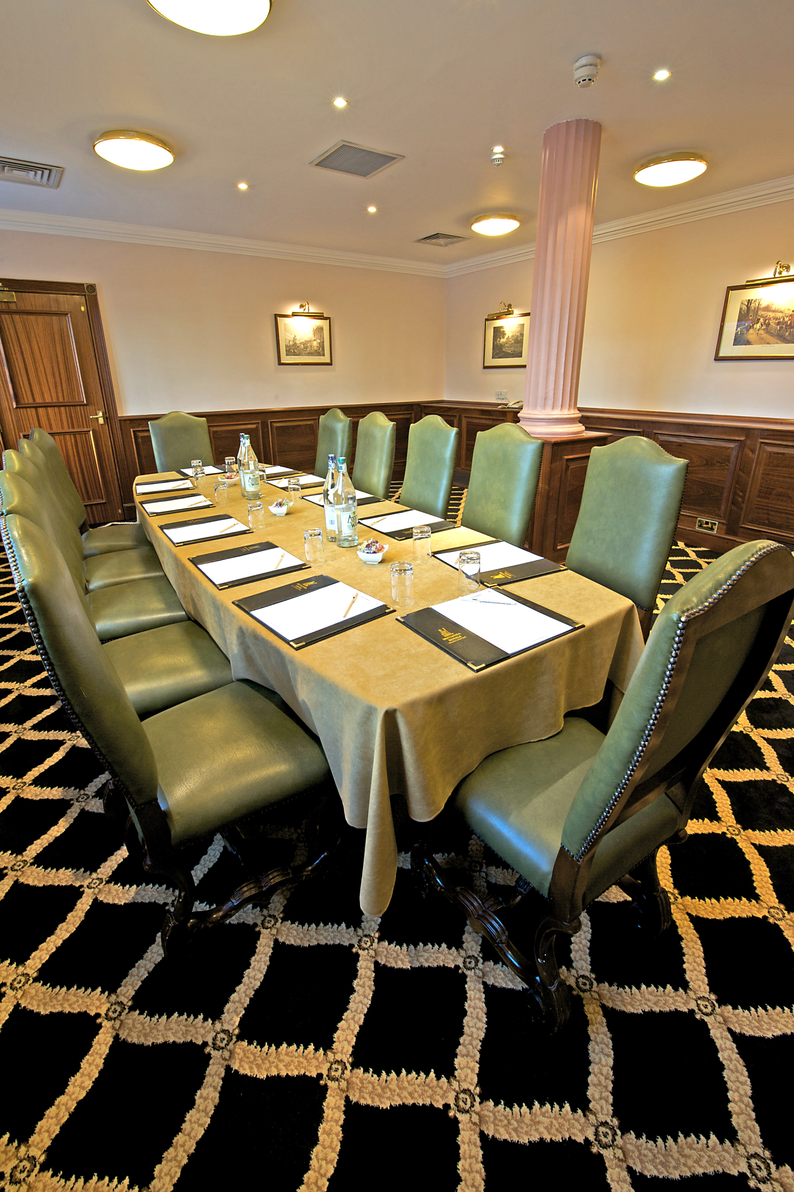 Boardroom at Britannia Hotel Manchester, elegant setup for professional meetings.