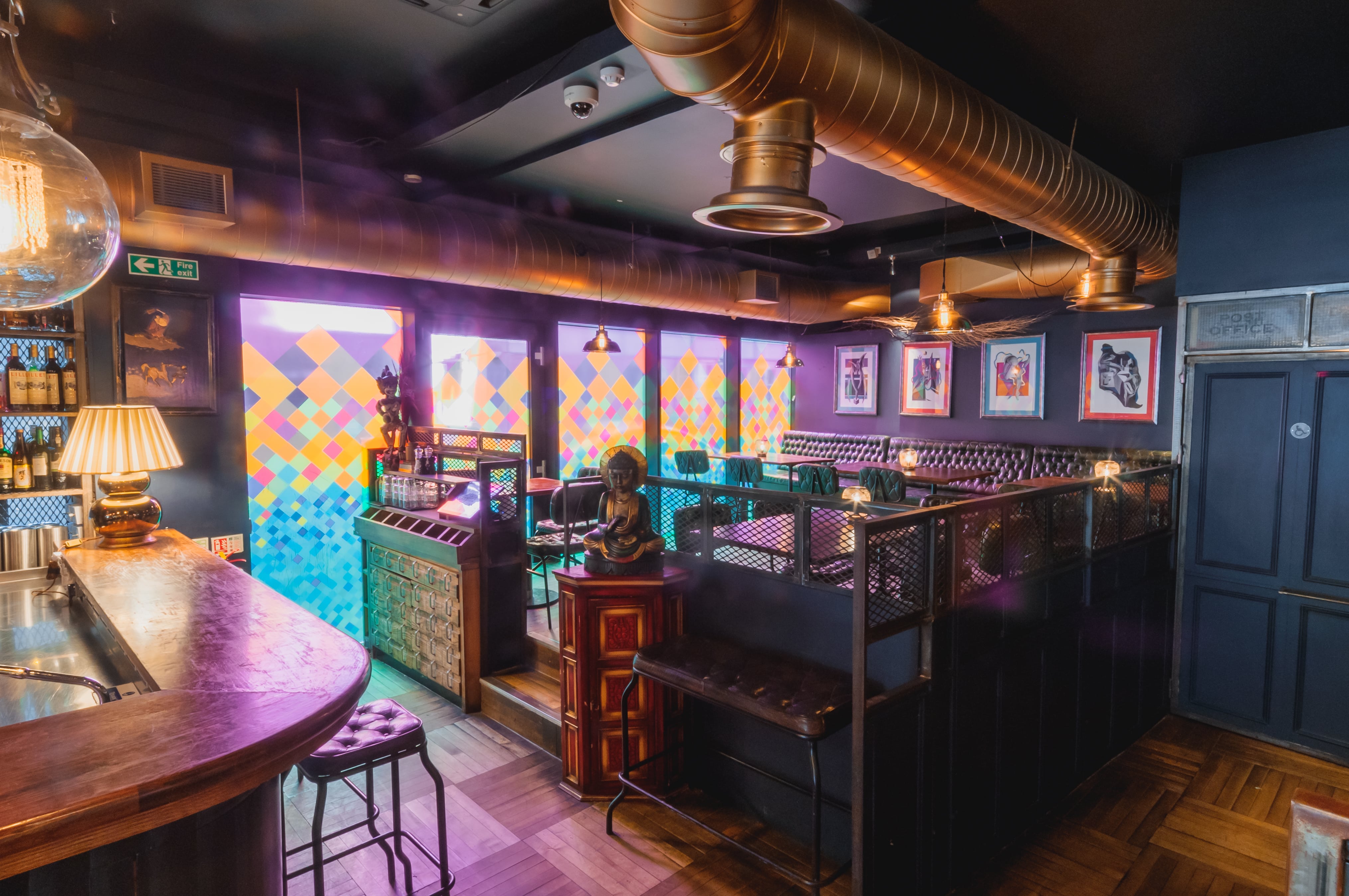 Vibrant venue with colorful windows for intimate gatherings and creative events.