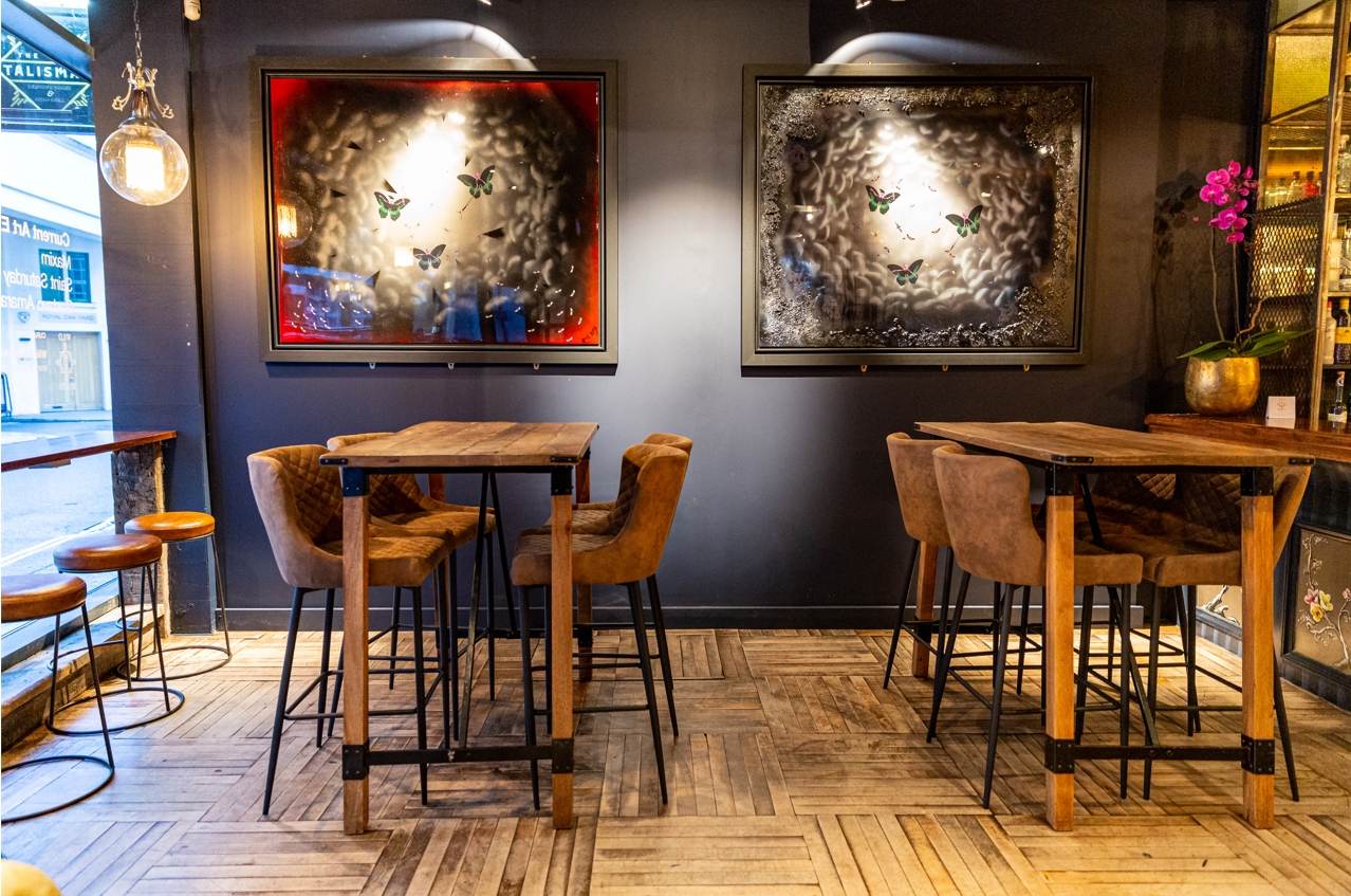 Stylish event space with high-top tables for networking and cocktail receptions.