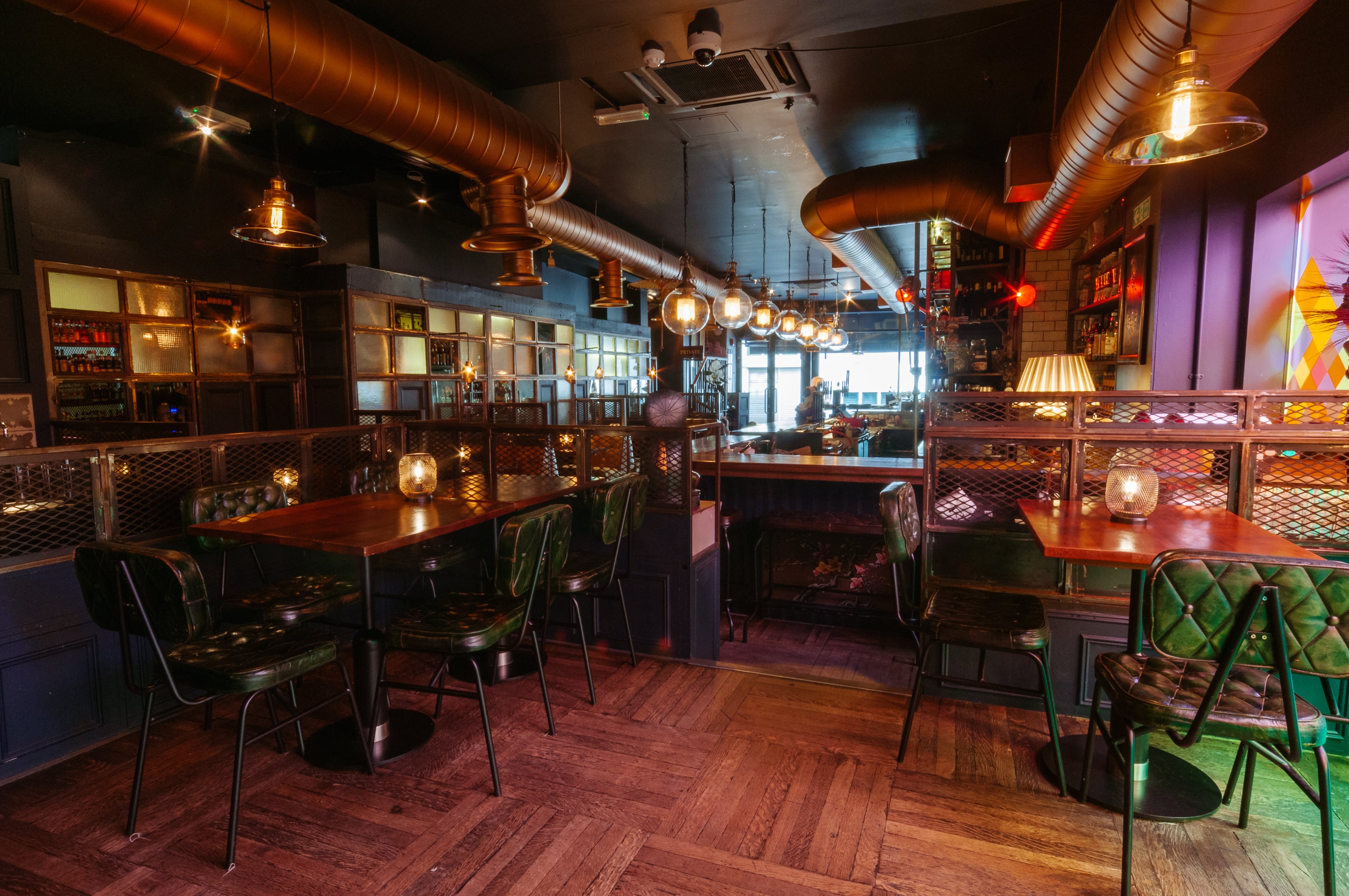 Stylish restaurant venue with warm lighting for intimate events and meetings.