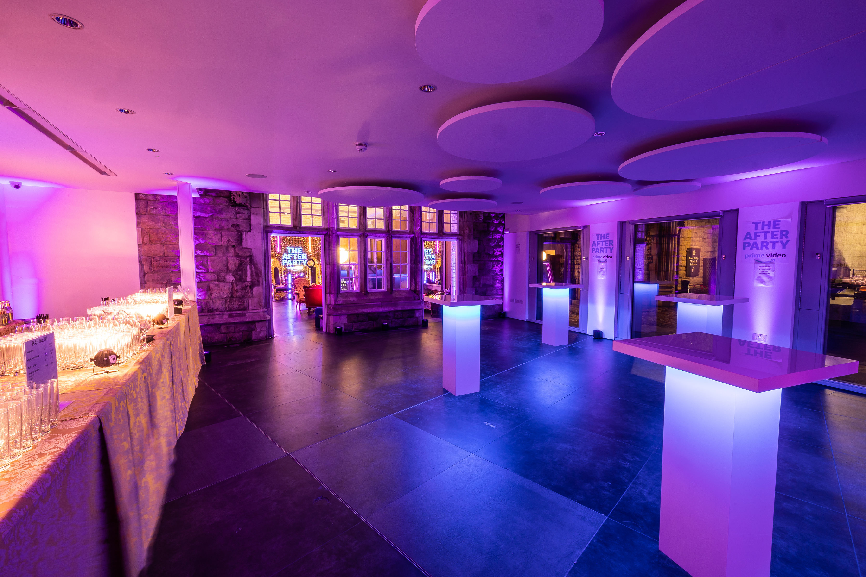 Stylish event space at HM Tower of London with purple lighting for cocktail receptions.