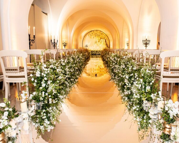 Elegant wedding venue with floral aisle and sophisticated decor in Banqueting House.