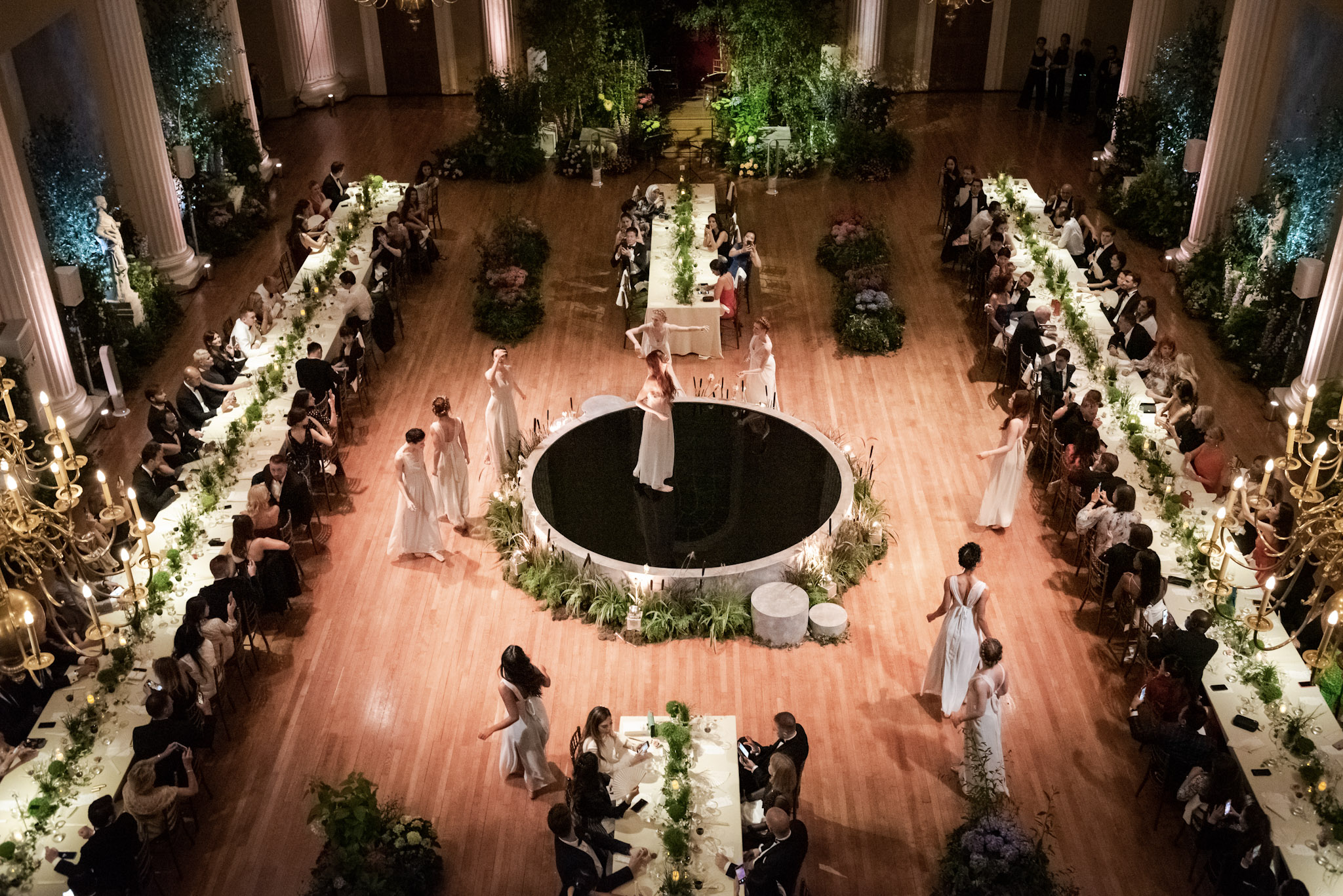 Elegant gala event at Banqueting House with lush decor and central stage for performances.