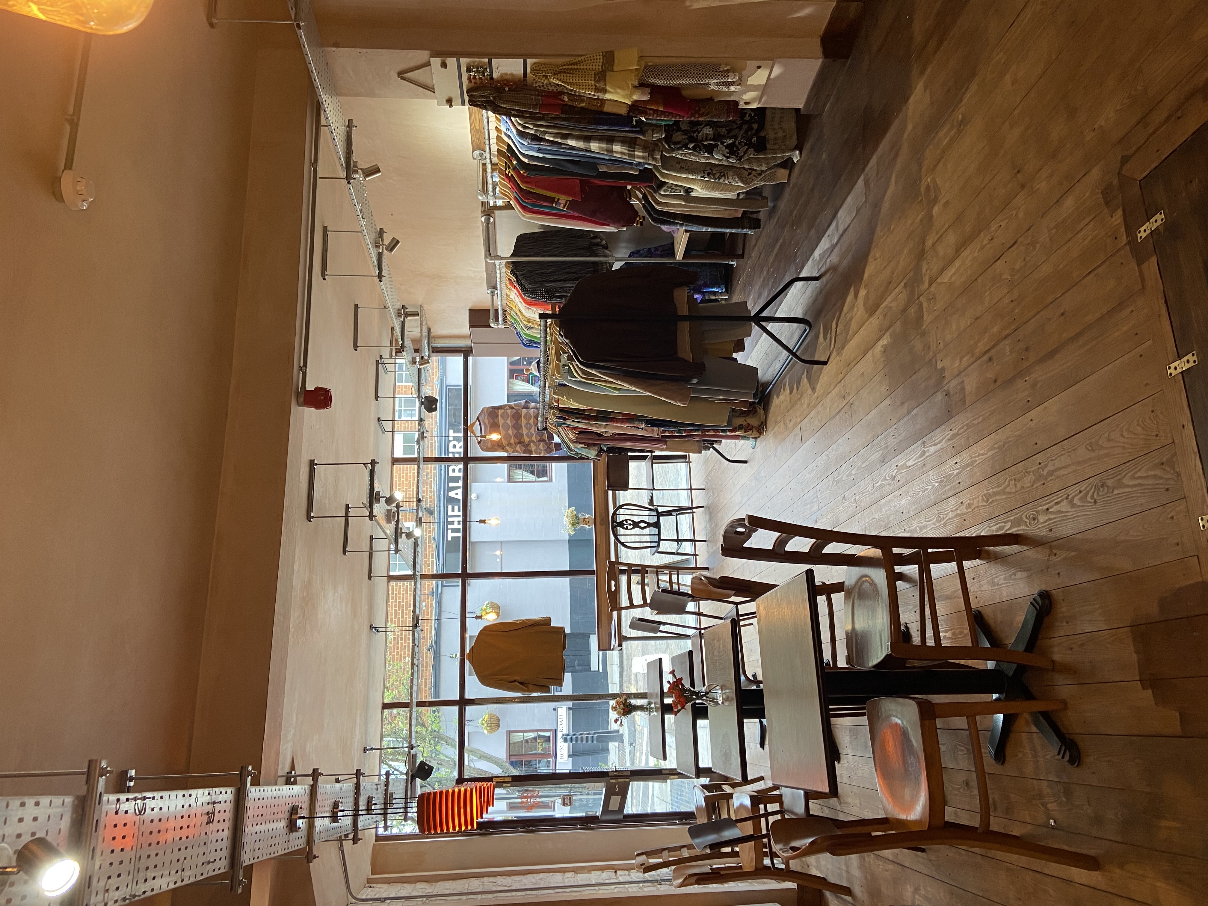 Cozy retail-dining space with stylish displays for pop-up events and workshops.