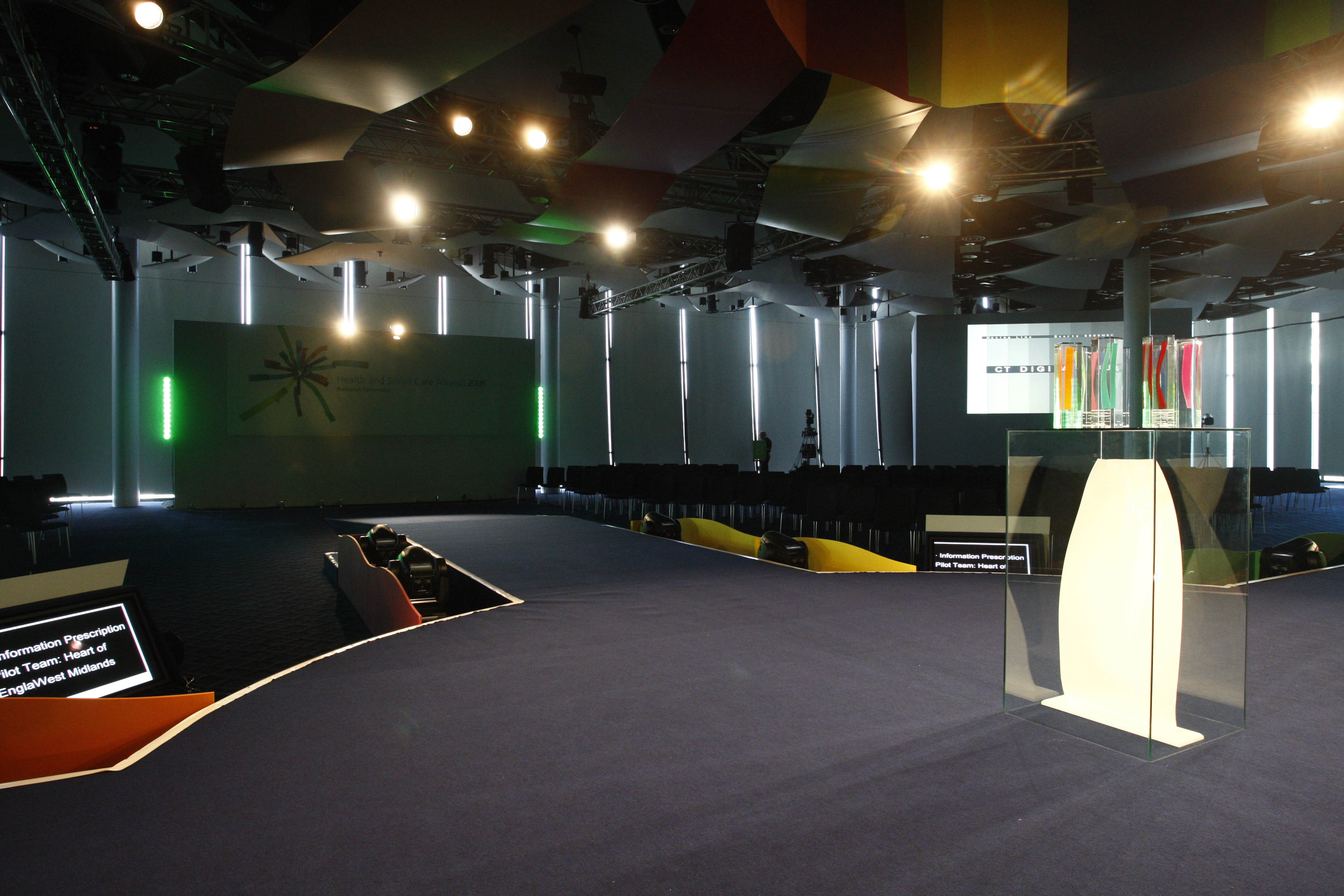 Great Hall at Wembley Stadium with sleek stage setup for corporate events.