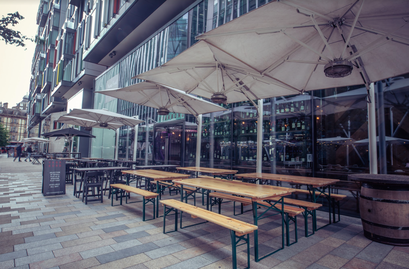 Royal box at Vagabond Victoria with wooden seating for outdoor networking events.