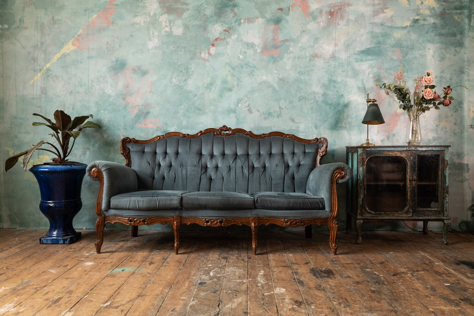 Bohemian lounge setup with tufted sofa for stylish event networking and relaxation.