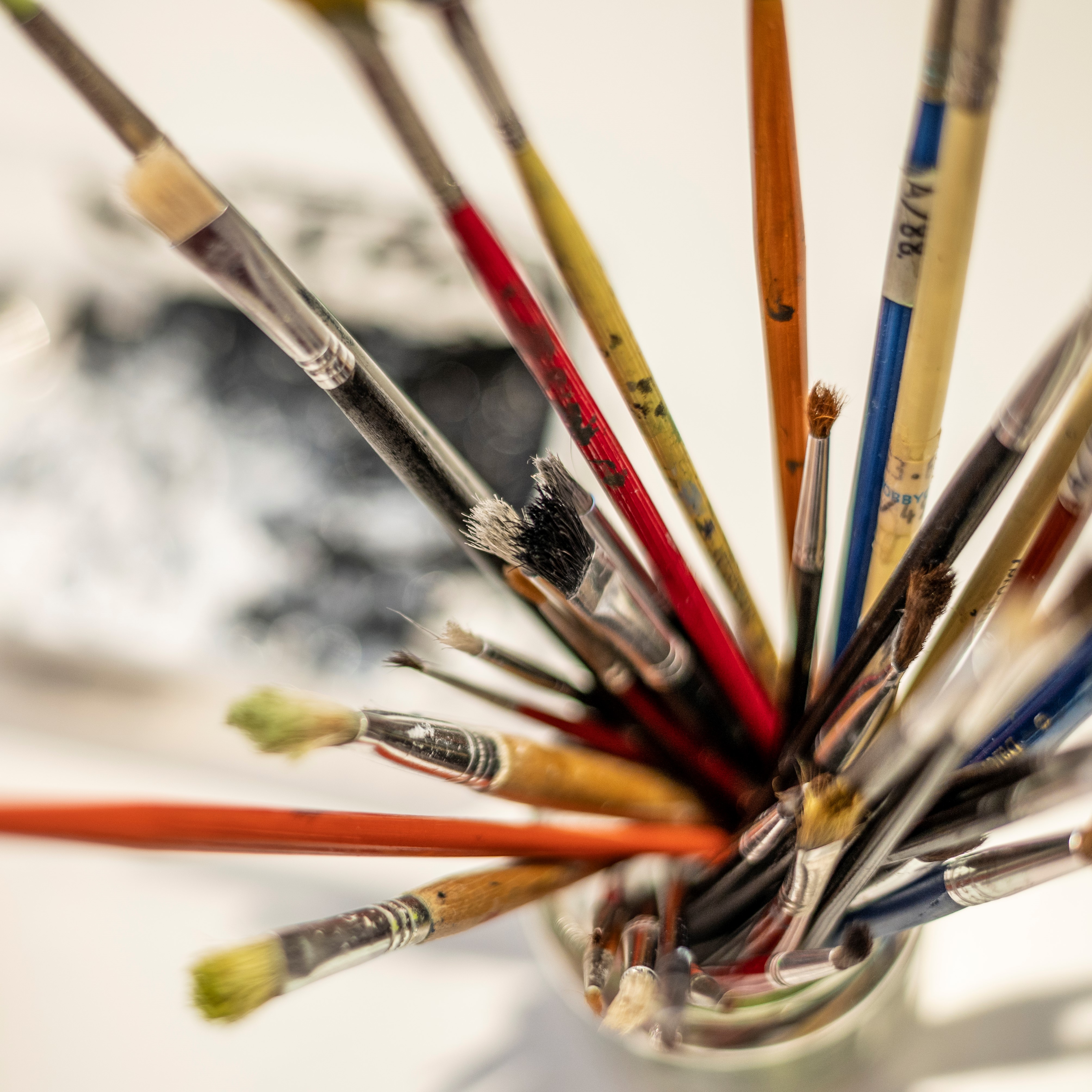 Vibrant paintbrushes in MerseyMade's event space for creative gatherings and workshops.