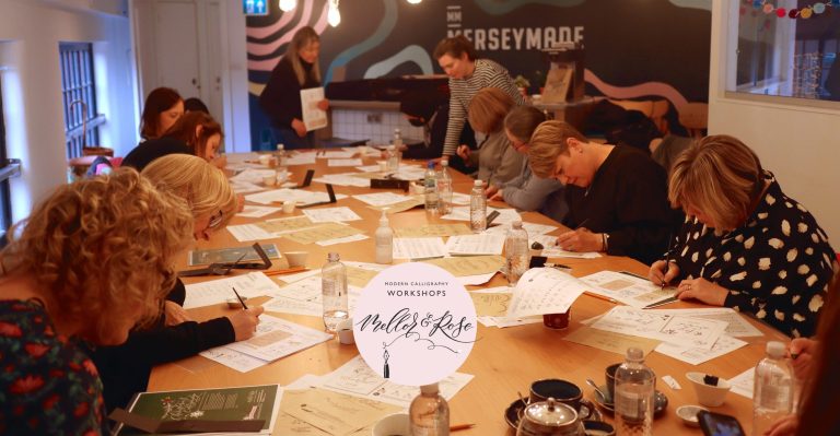 Collaborative workshop at MerseyMade with participants engaged in hands-on activities.