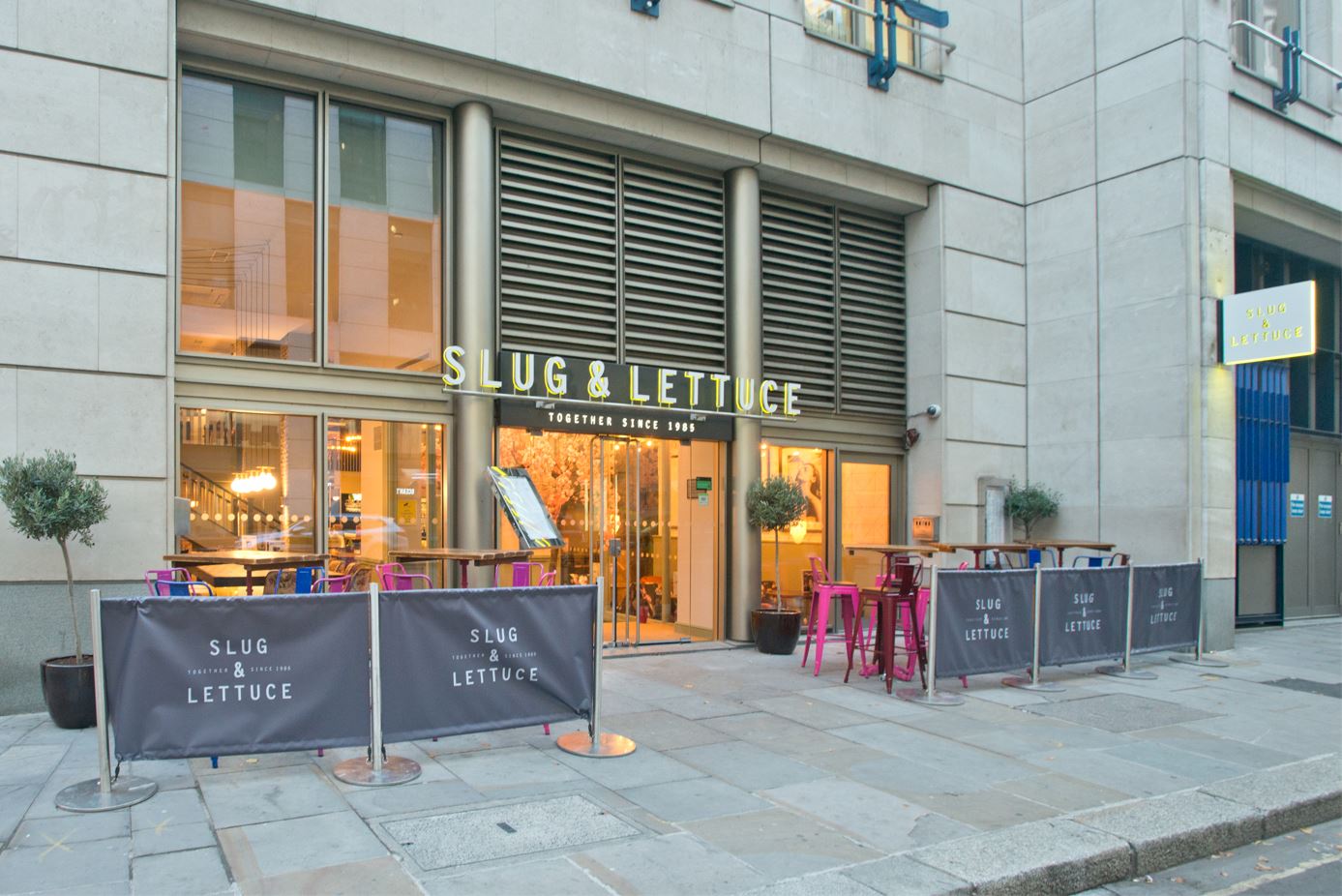 Vibrant outdoor venue at Slug & Lettuce, ideal for casual meetings and events.