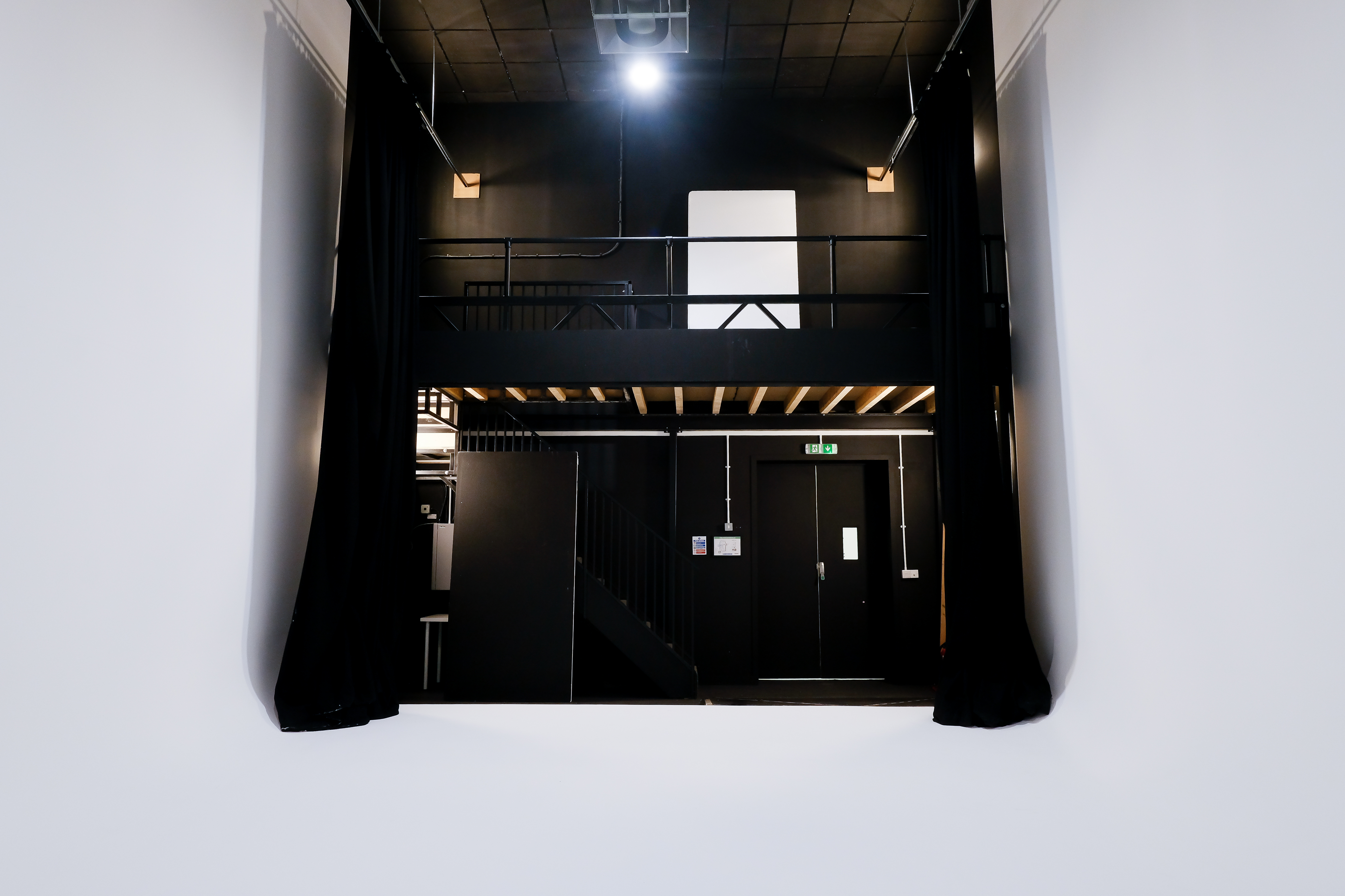 Modern industrial event space with flexible lighting for corporate meetings and creative events.