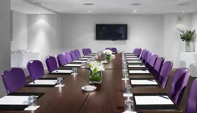 Pegasus and Phoenix Suite at Radisson Blu Hotel, Bristol - elegant meeting room with purple chairs.
