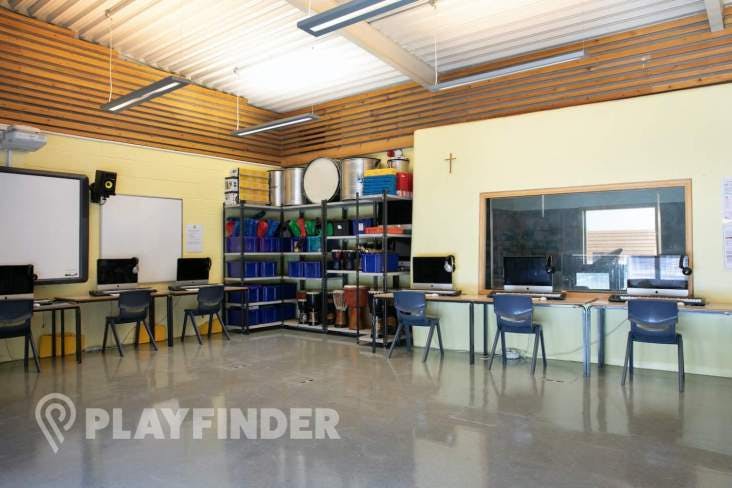 Versatile music room at St Aloysius' College, ideal for workshops and training sessions.