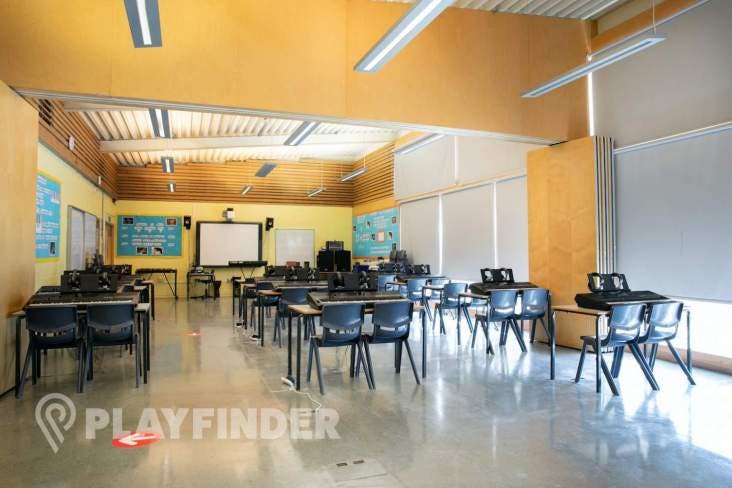 Spacious music room at St Aloysius' College, ideal for workshops and presentations.