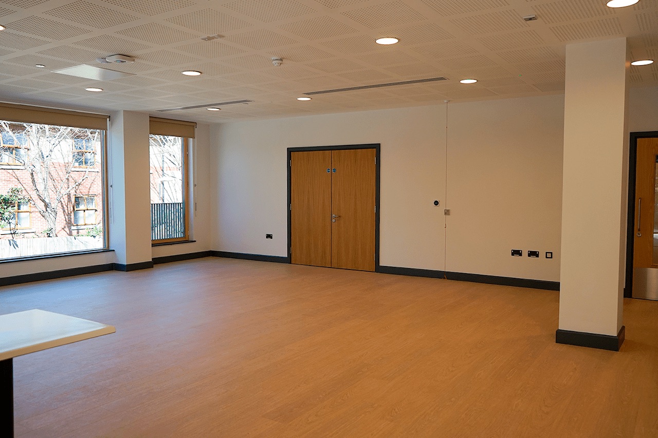 Hive Cafe event space with natural light, ideal for meetings and workshops.
