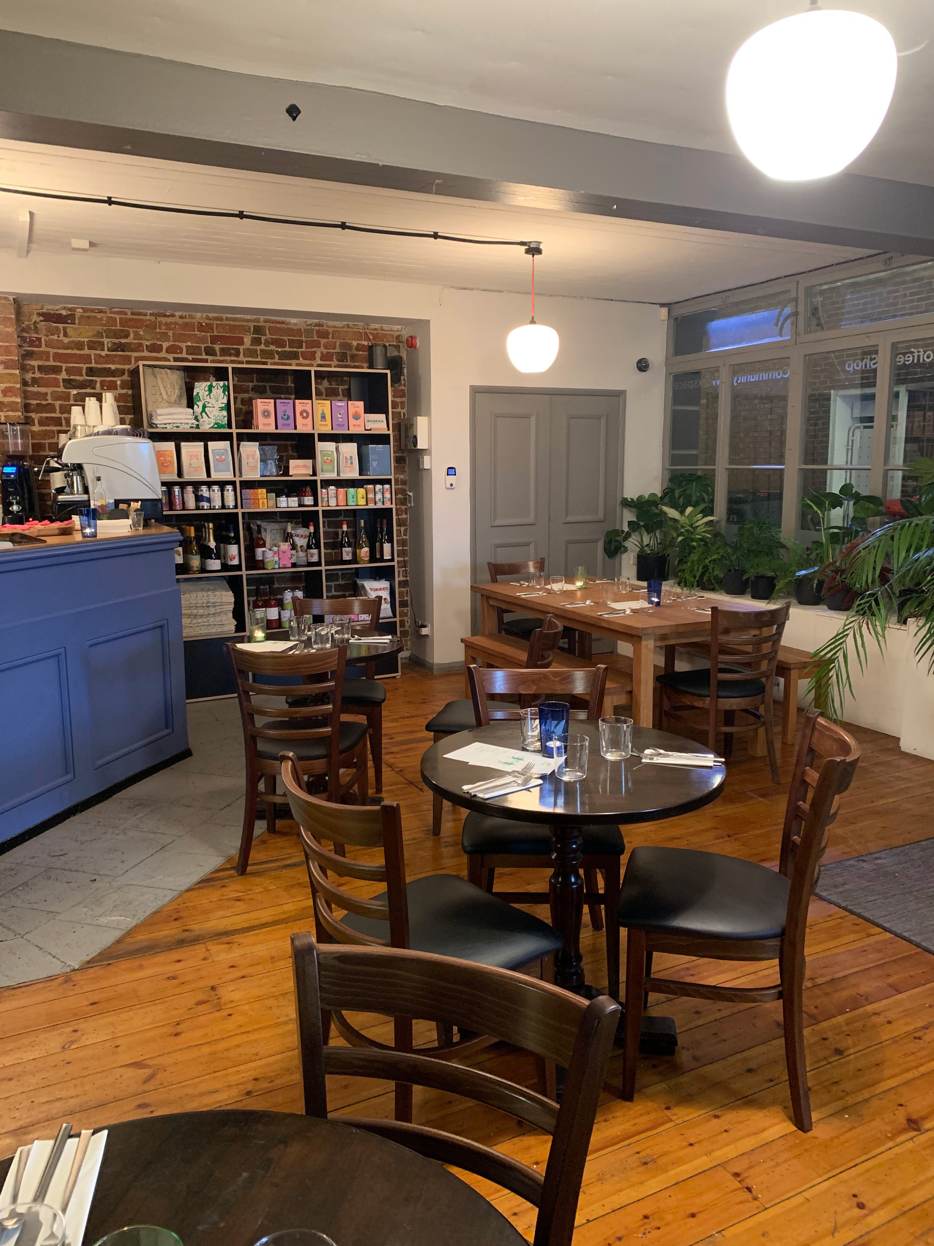 Cozy Bodega Eastbourne venue with rustic brick wall, ideal for networking events.