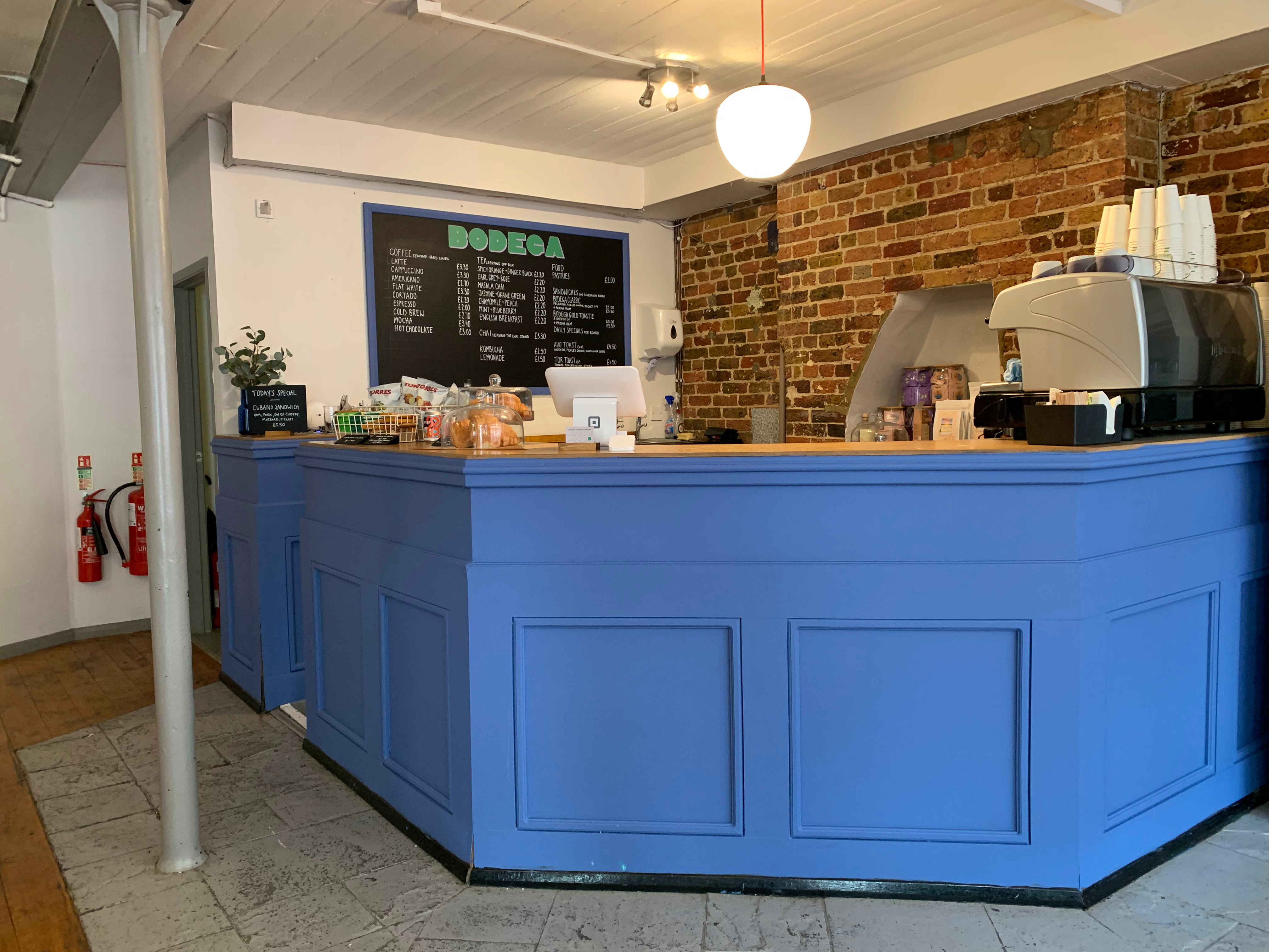 Vibrant café counter at Bodega Eastbourne, ideal for networking and informal meetings.