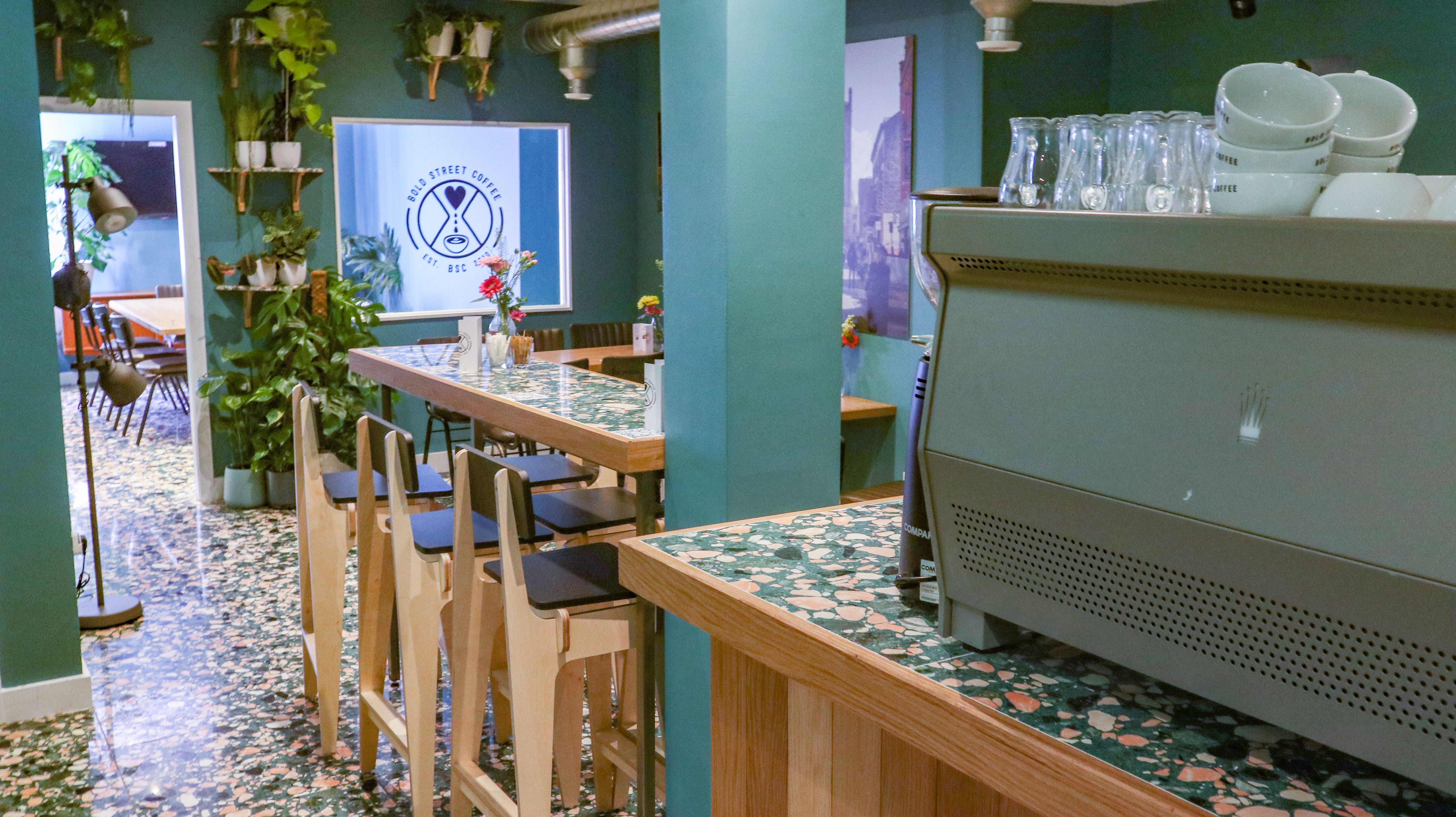 Event space at Bold Street Coffee Liverpool with modern bar, ideal for meetings and gatherings.