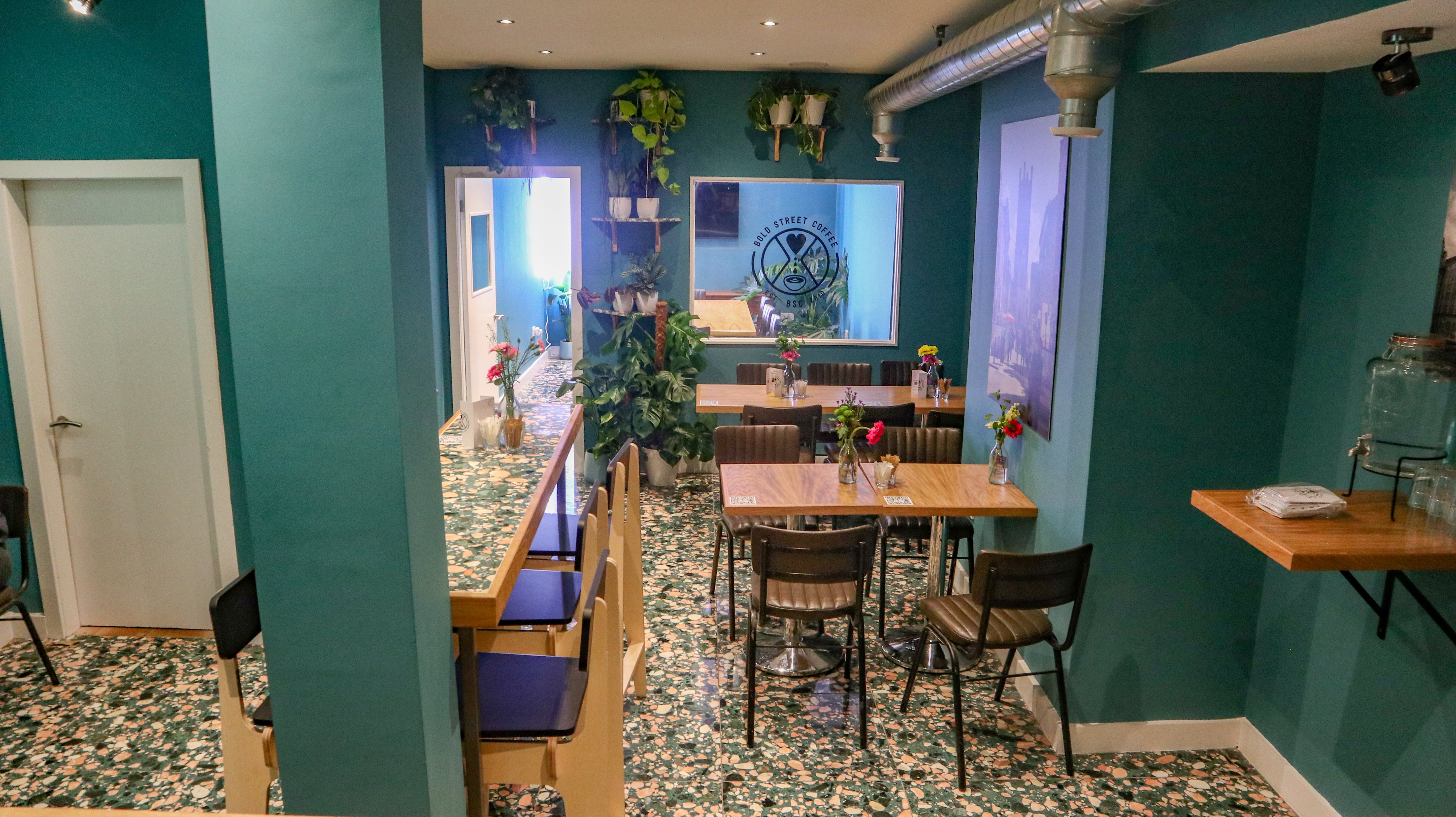 Vibrant event space with greenery for workshops and gatherings in Bold Street Coffee, Liverpool.