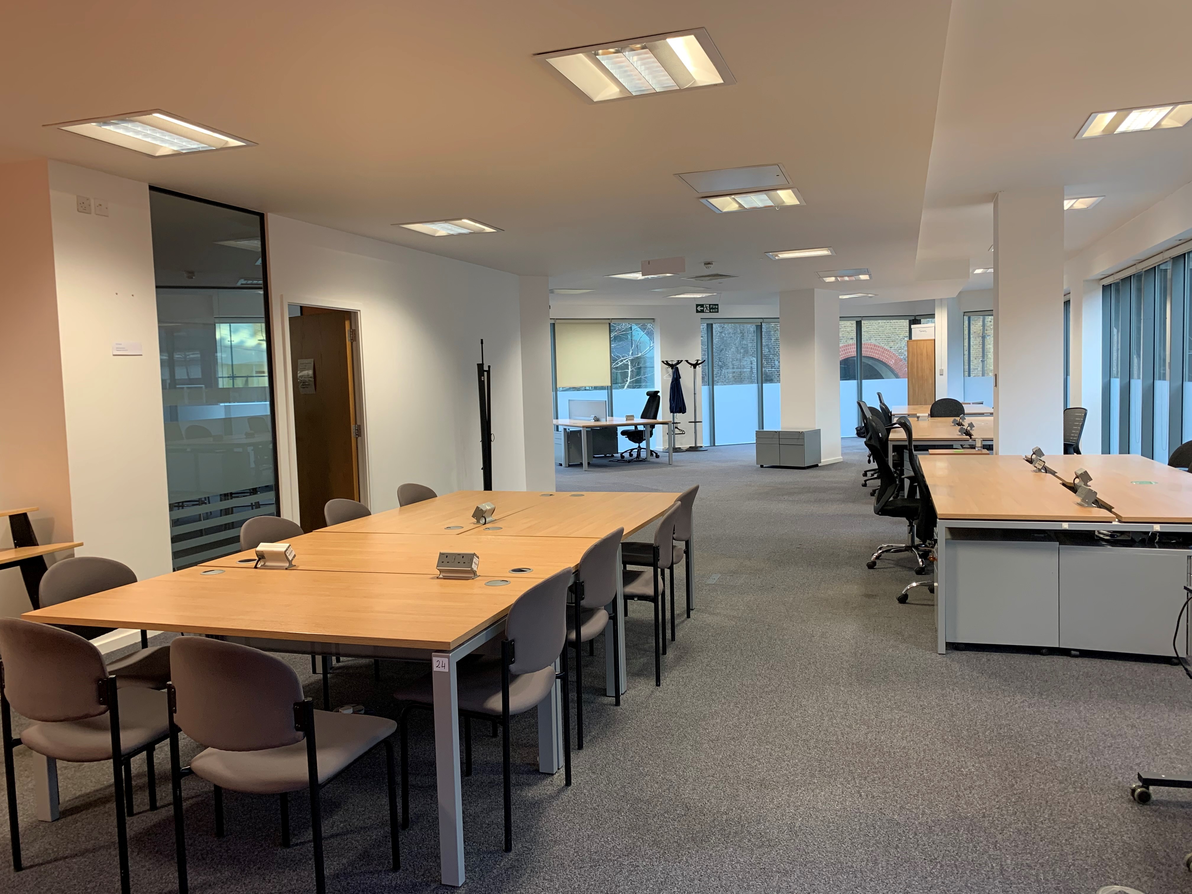 Versatile MDUK office meeting space with modular tables, ideal for workshops and team meetings.