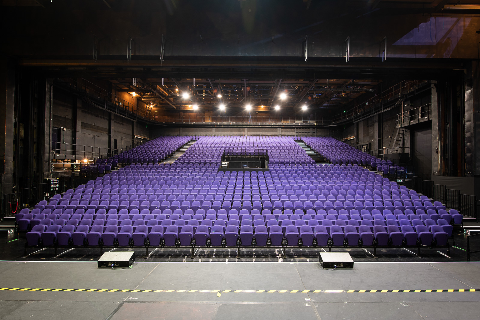 Empty auditorium with purple seats at Troubadour Wembley Park Theatre for events.