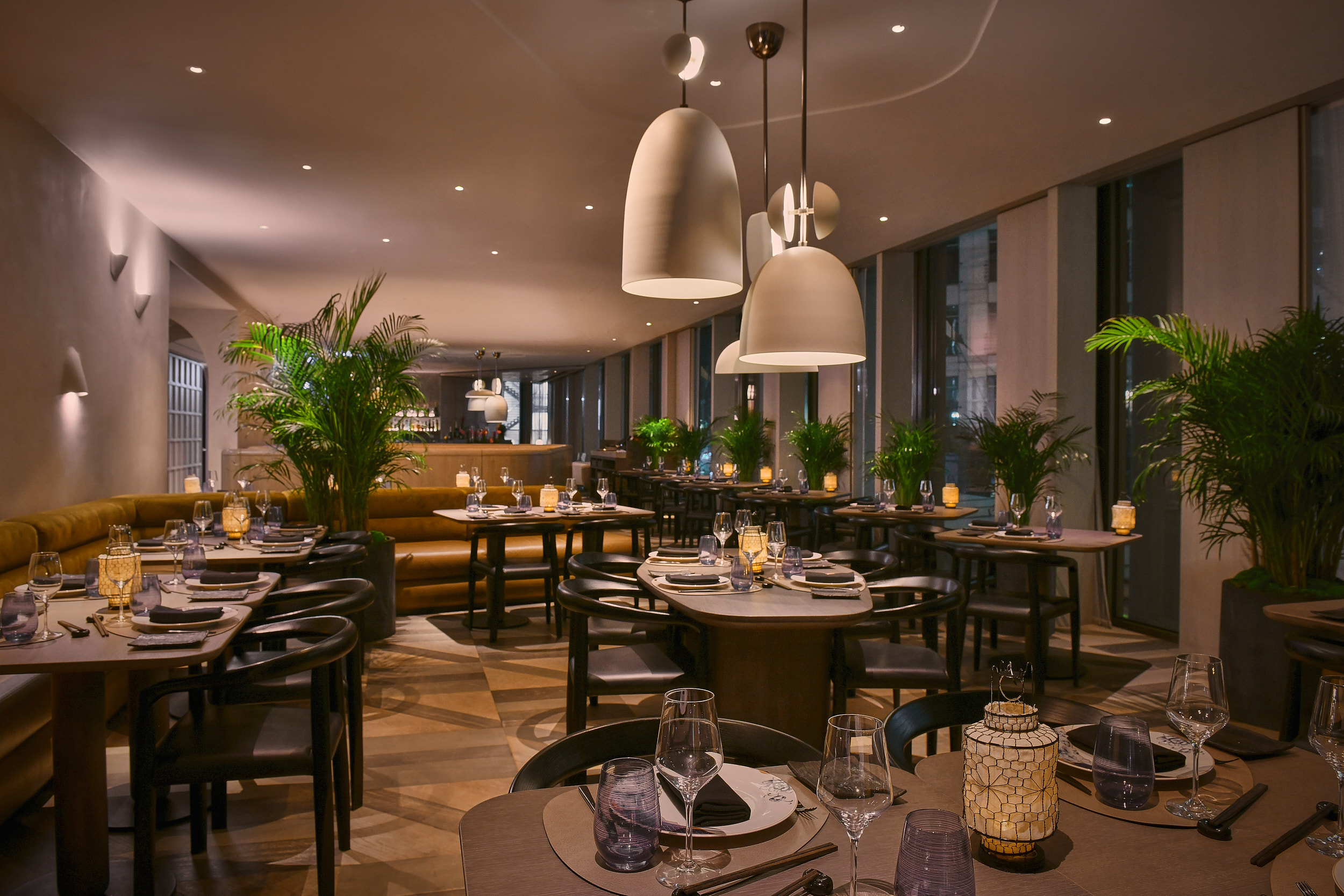 Modern restaurant setting with warm lighting for intimate gatherings and corporate events.