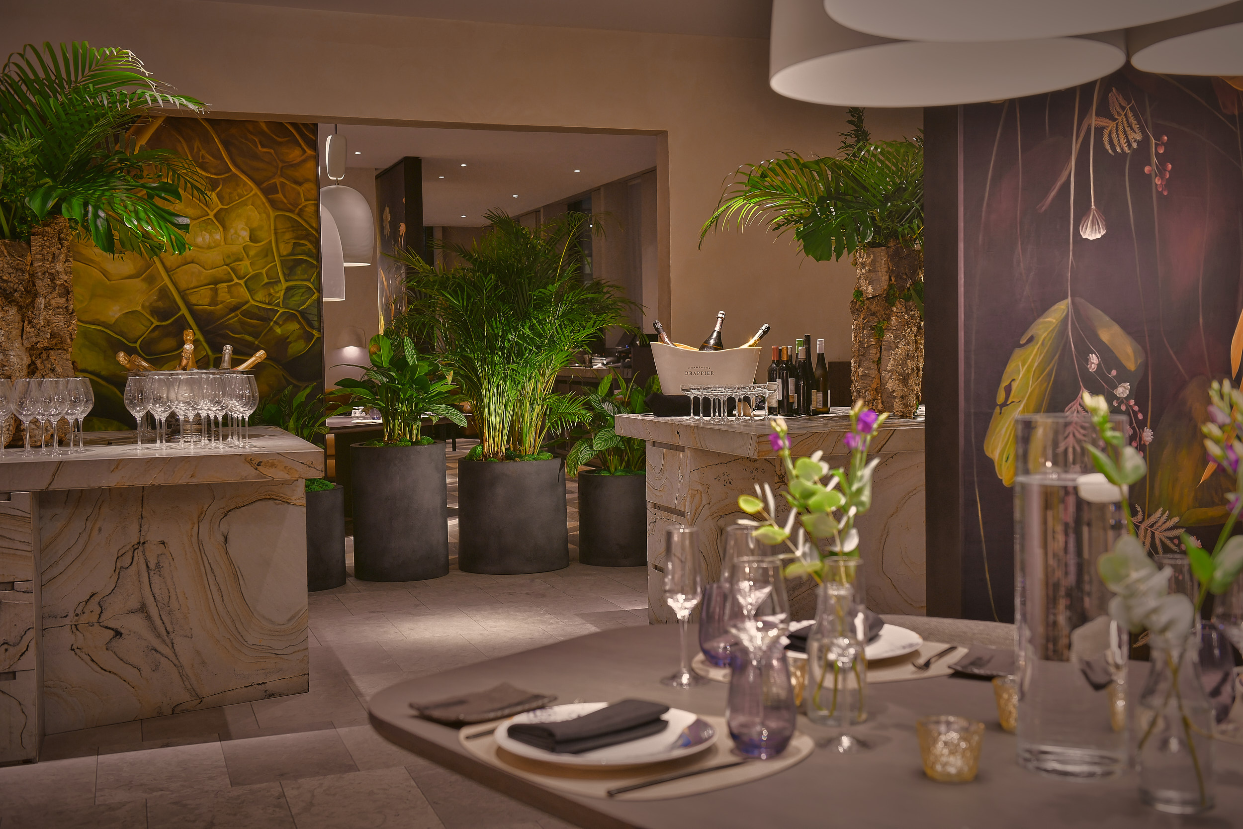 Elegant event space in Straits Kitchen, featuring lush greenery for upscale gatherings.