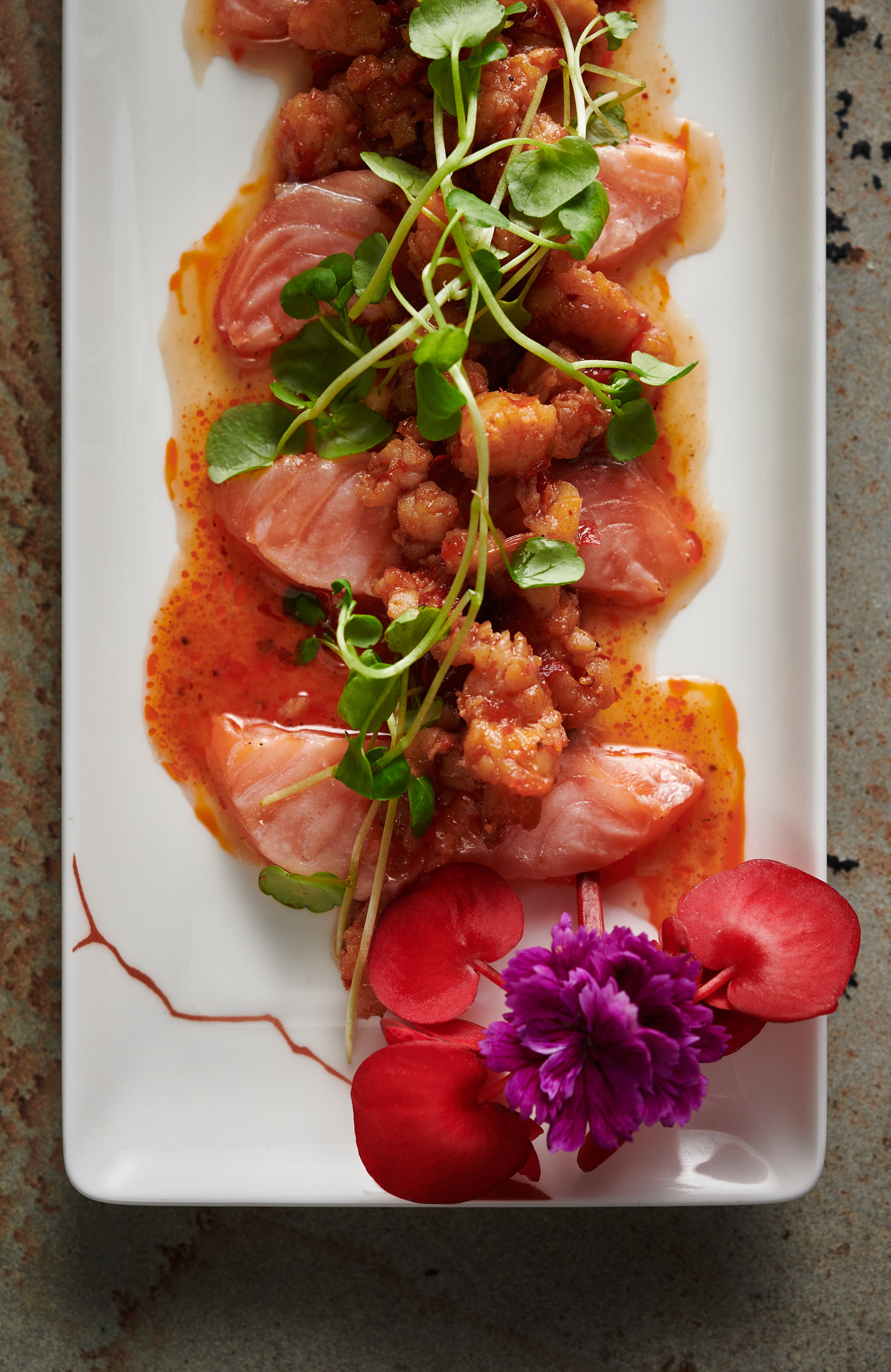 Upscale salmon dish with microgreens at Straits Kitchen for corporate events and weddings.