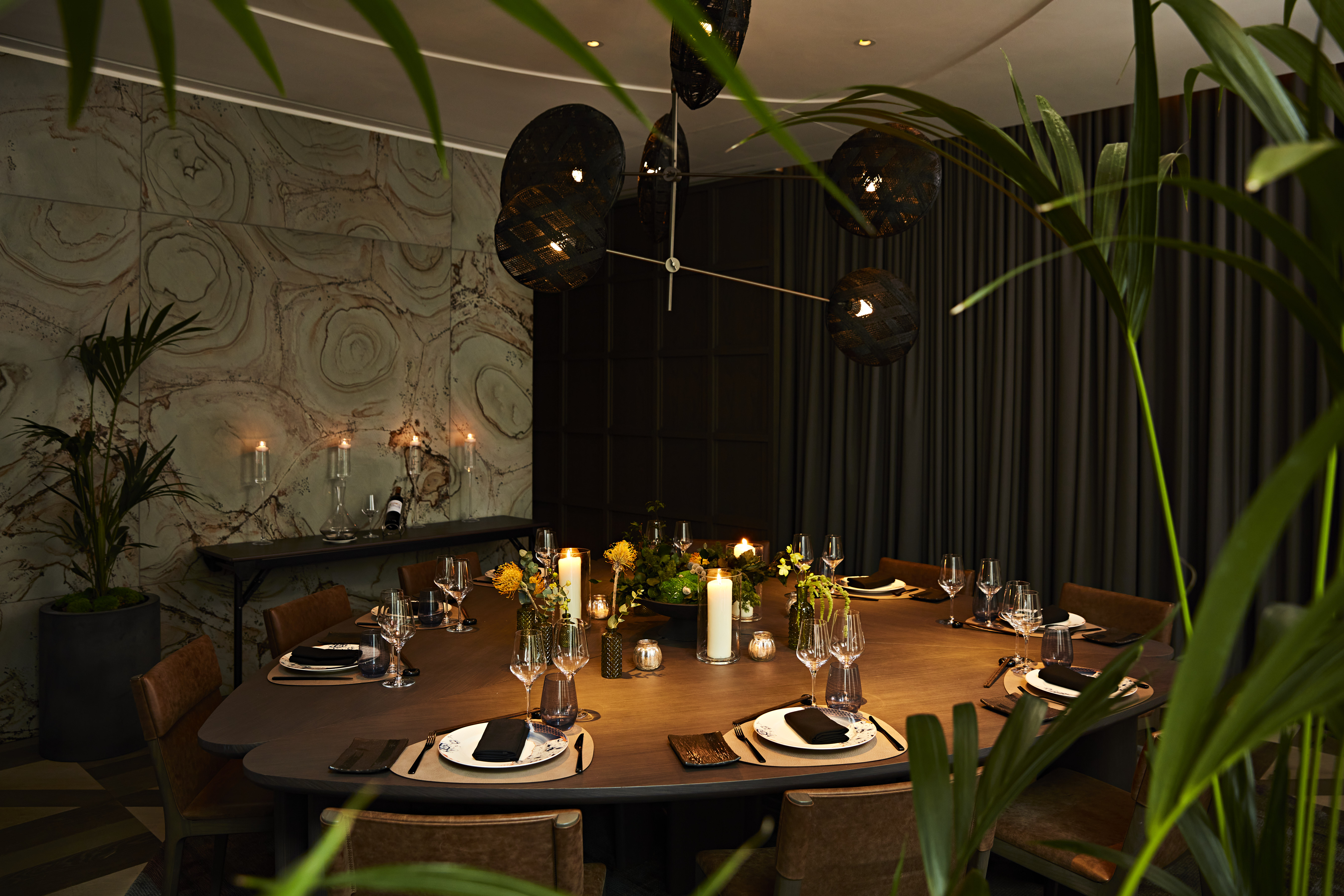 Elegant private dining room with round table for corporate retreats and exclusive events.